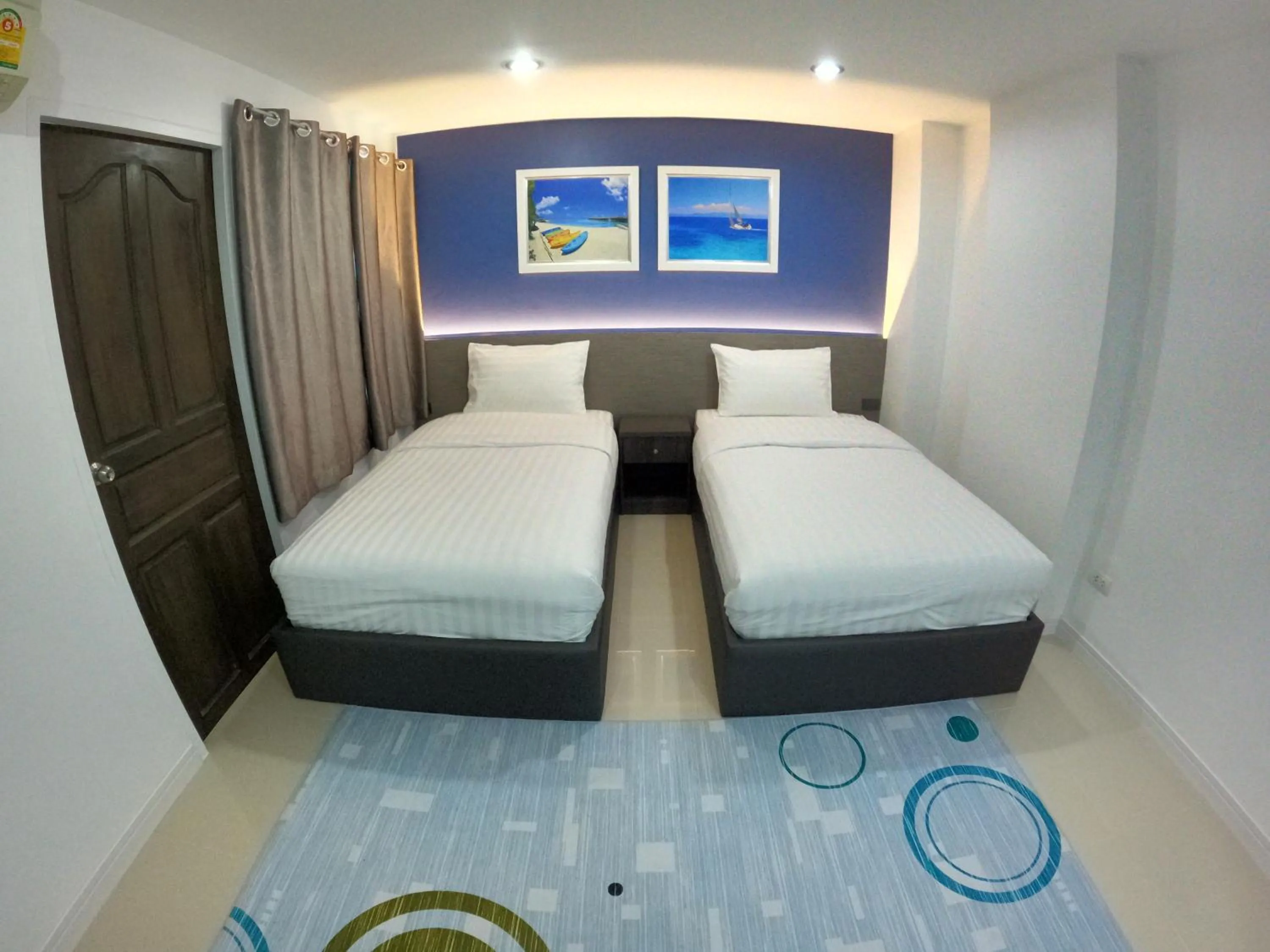 Bed in Poonsuk Place Hotel