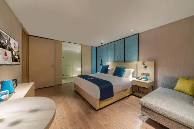 Bed in Echarm Hotel Foshan Guangfo Road Jiaokou Metro Station