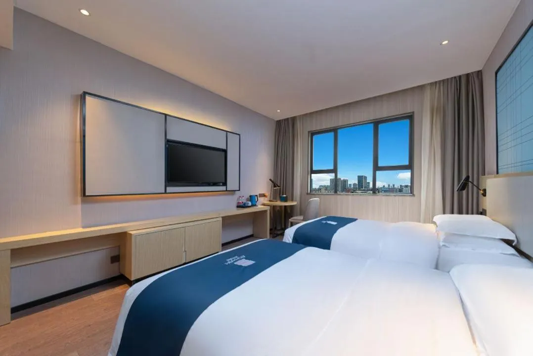 Bed in Echarm Hotel Foshan Guangfo Road Jiaokou Metro Station