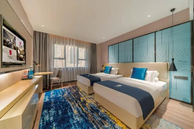 Bed in Echarm Hotel Foshan Guangfo Road Jiaokou Metro Station