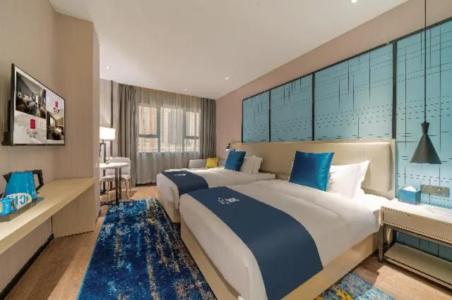 Bed in Echarm Hotel Foshan Guangfo Road Jiaokou Metro Station