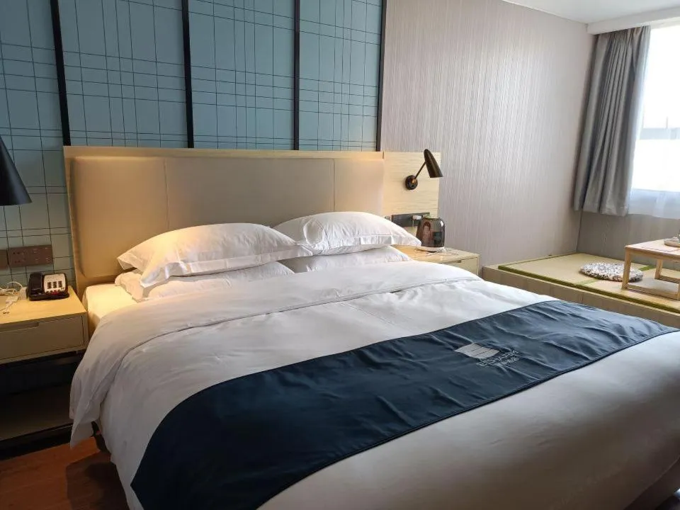 Bed in Echarm Hotel Foshan Guangfo Road Jiaokou Metro Station