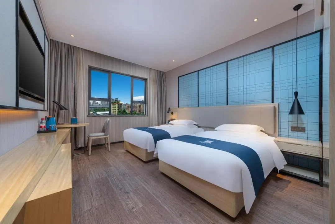 Bed in Echarm Hotel Foshan Guangfo Road Jiaokou Metro Station