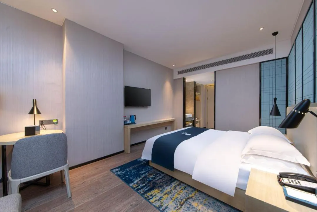 Bed in Echarm Hotel Foshan Guangfo Road Jiaokou Metro Station