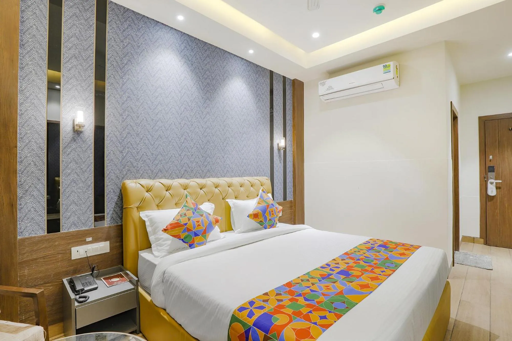 Bed in FabHotel Meritus Inn