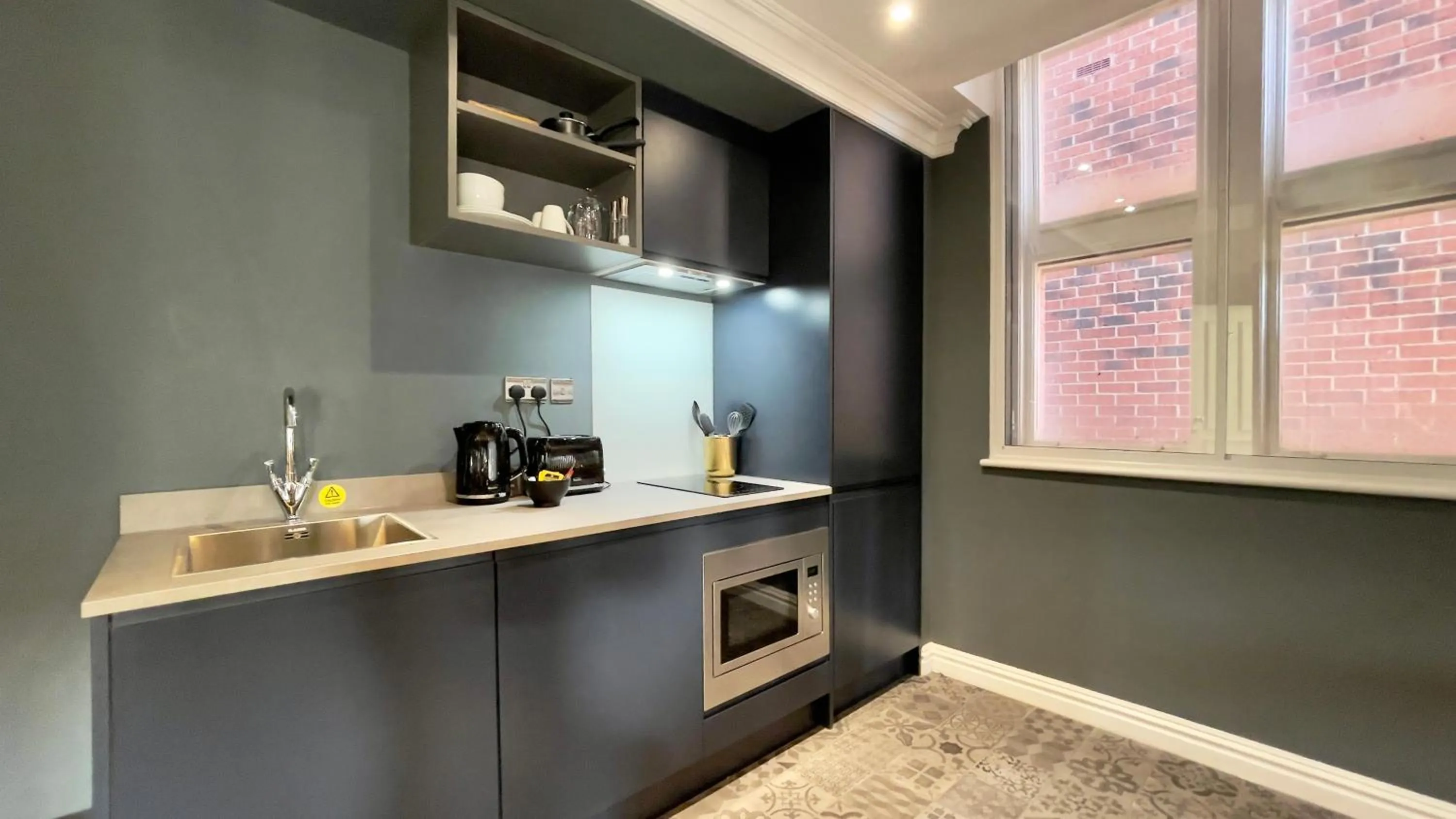 Kitchen or kitchenette in The Old Post Office Warrington by Deuce Hotels