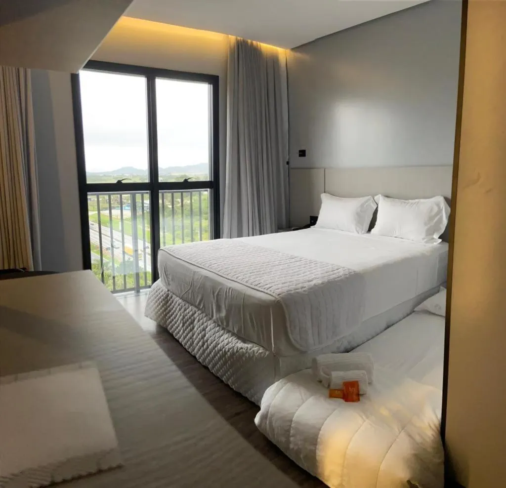 Photo of the whole room, Bed in Intercity Itapema