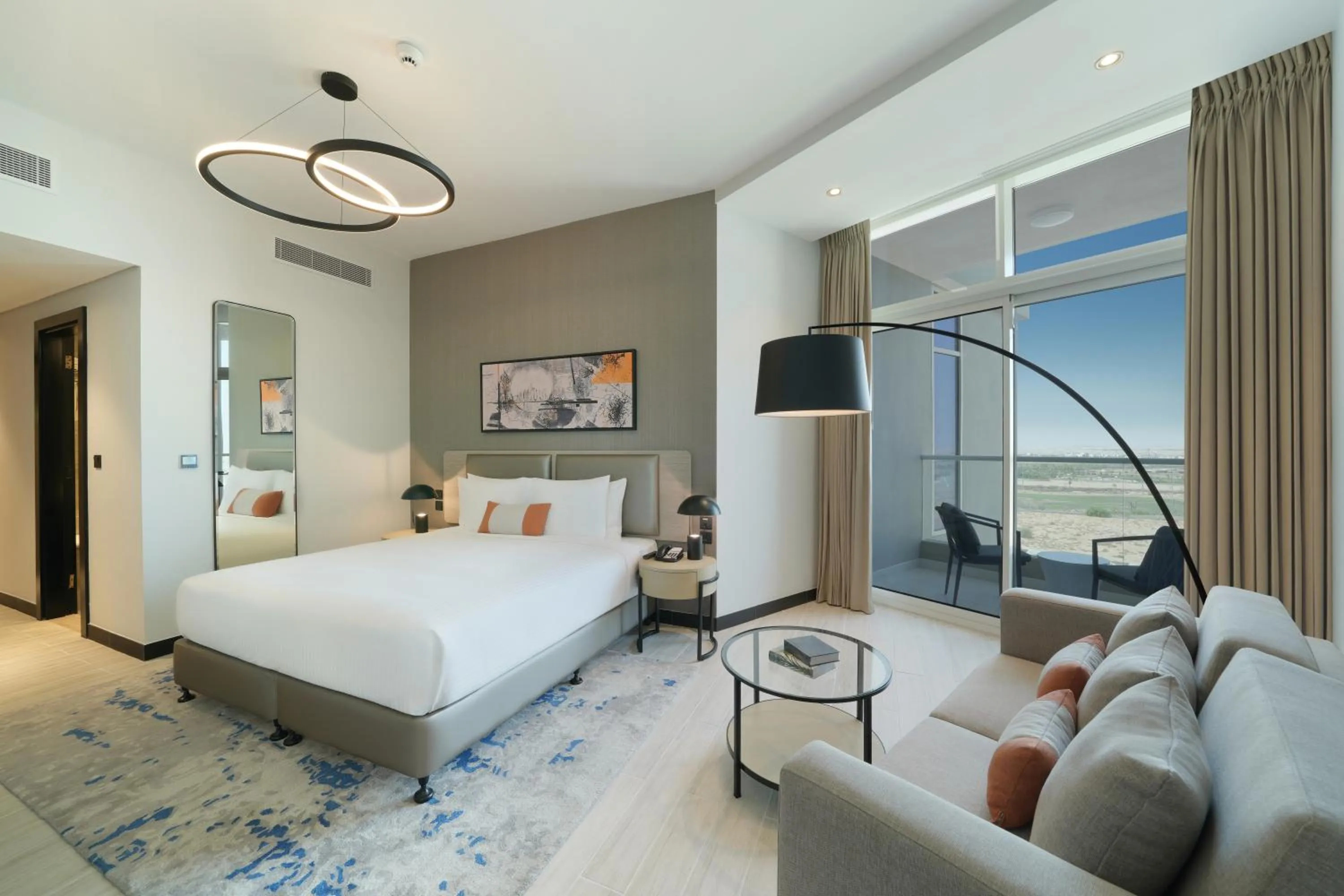 Bed in DAMAC Hills 2 Hotel, an Edge by Rotana Hotel