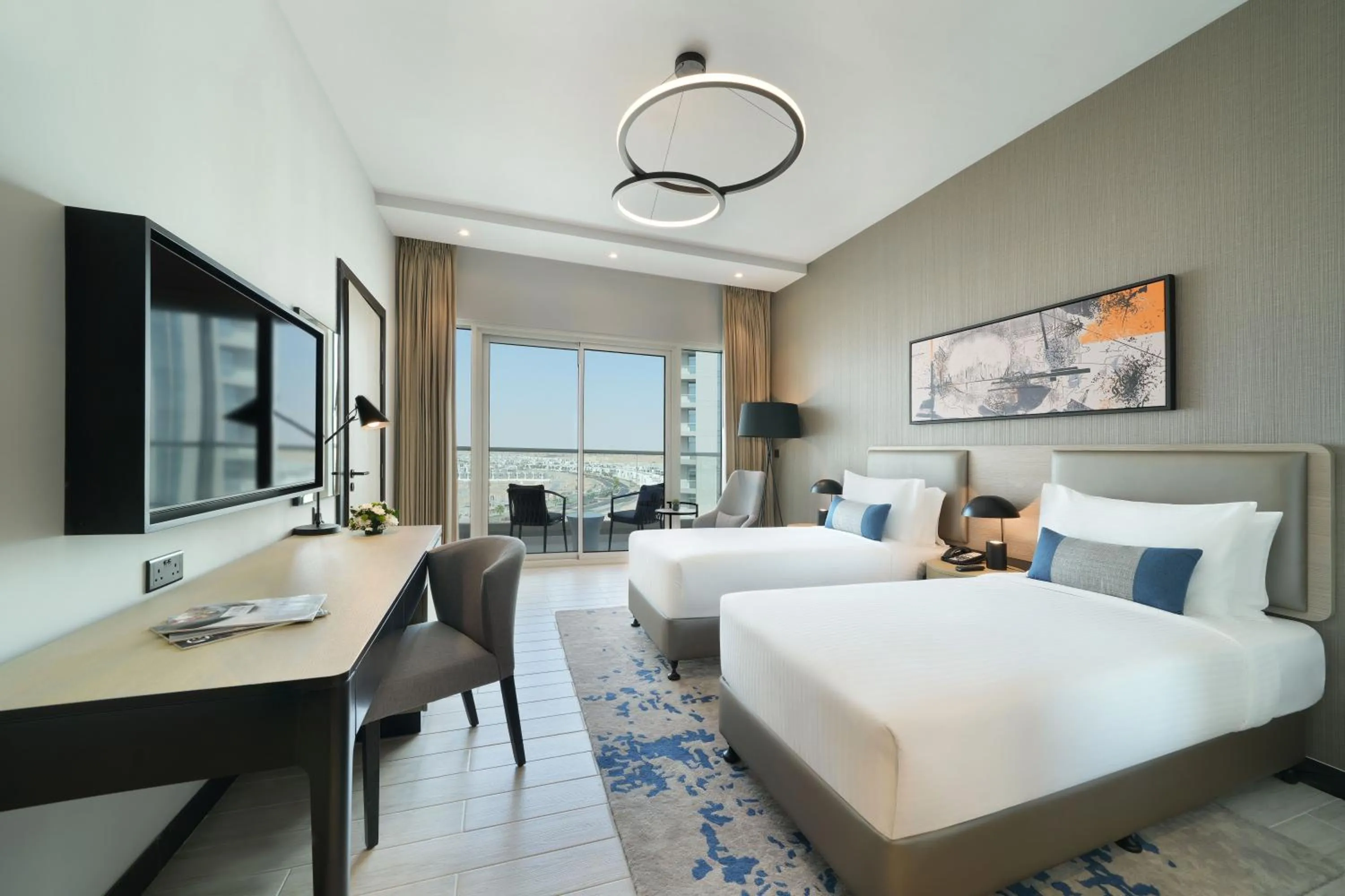 Bed in DAMAC Hills 2 Hotel, an Edge by Rotana Hotel