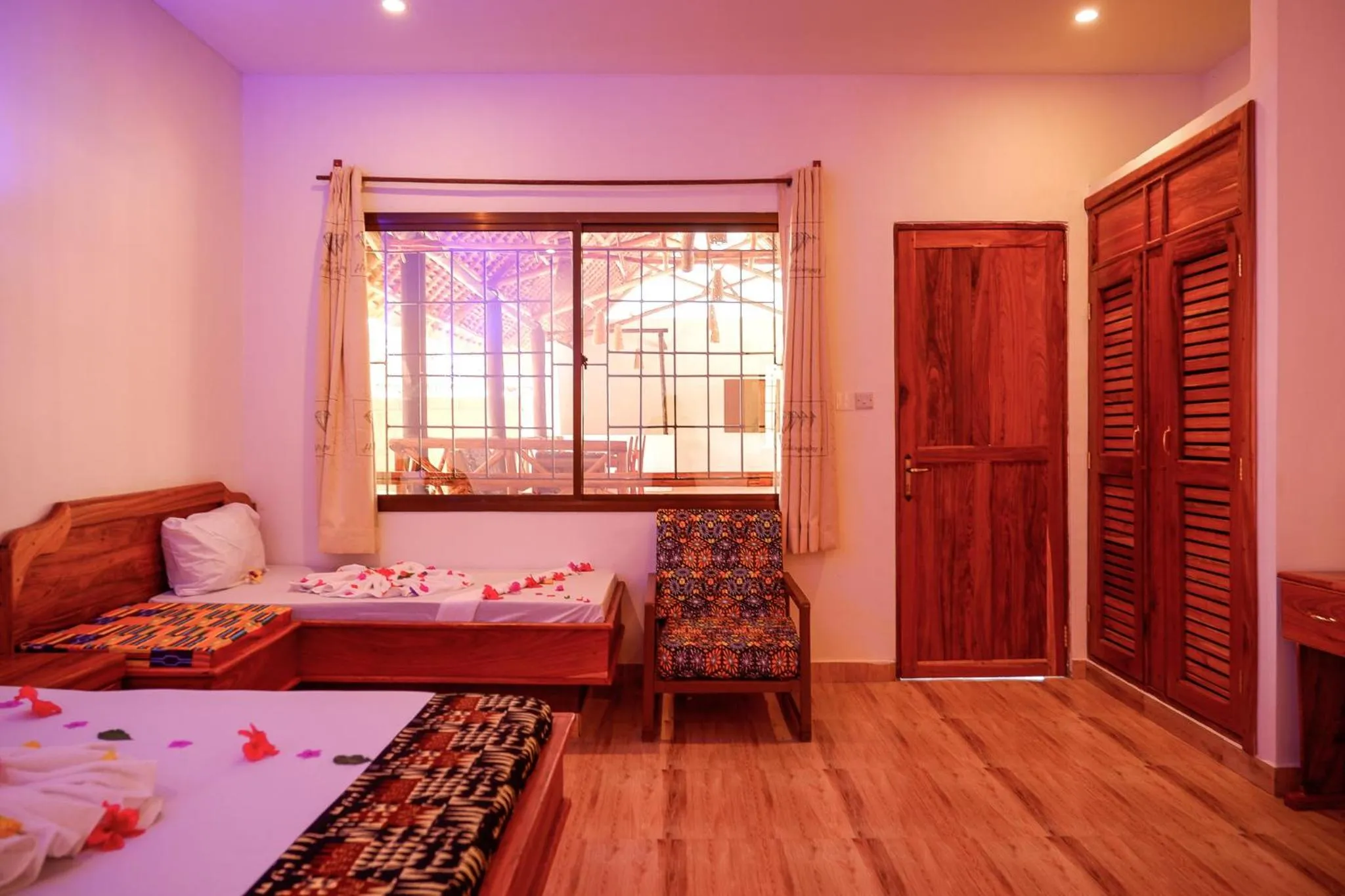 Photo of the whole room, Bed in Nungwi Heritage Resort