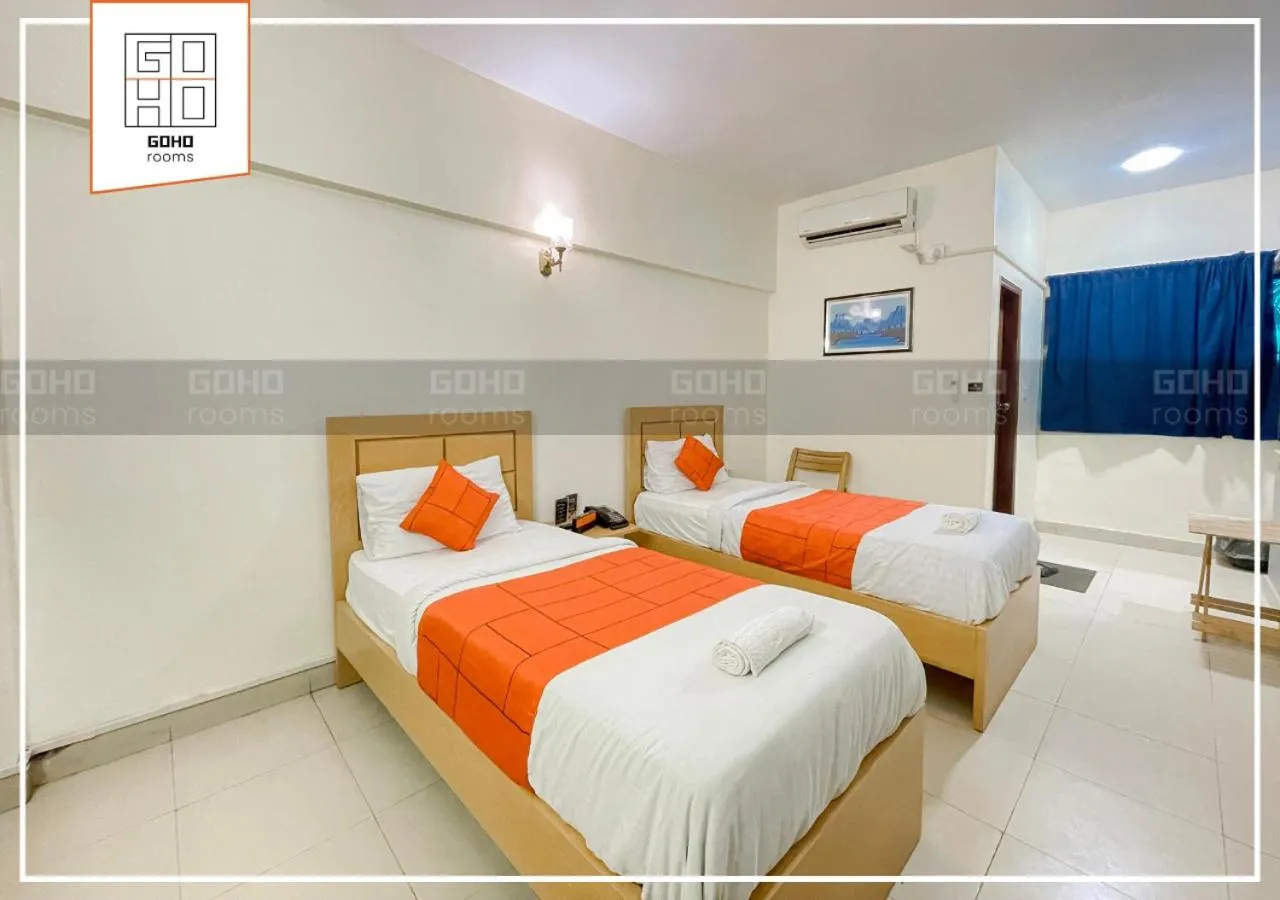 Bed in GOHO Rooms 10th Commercial