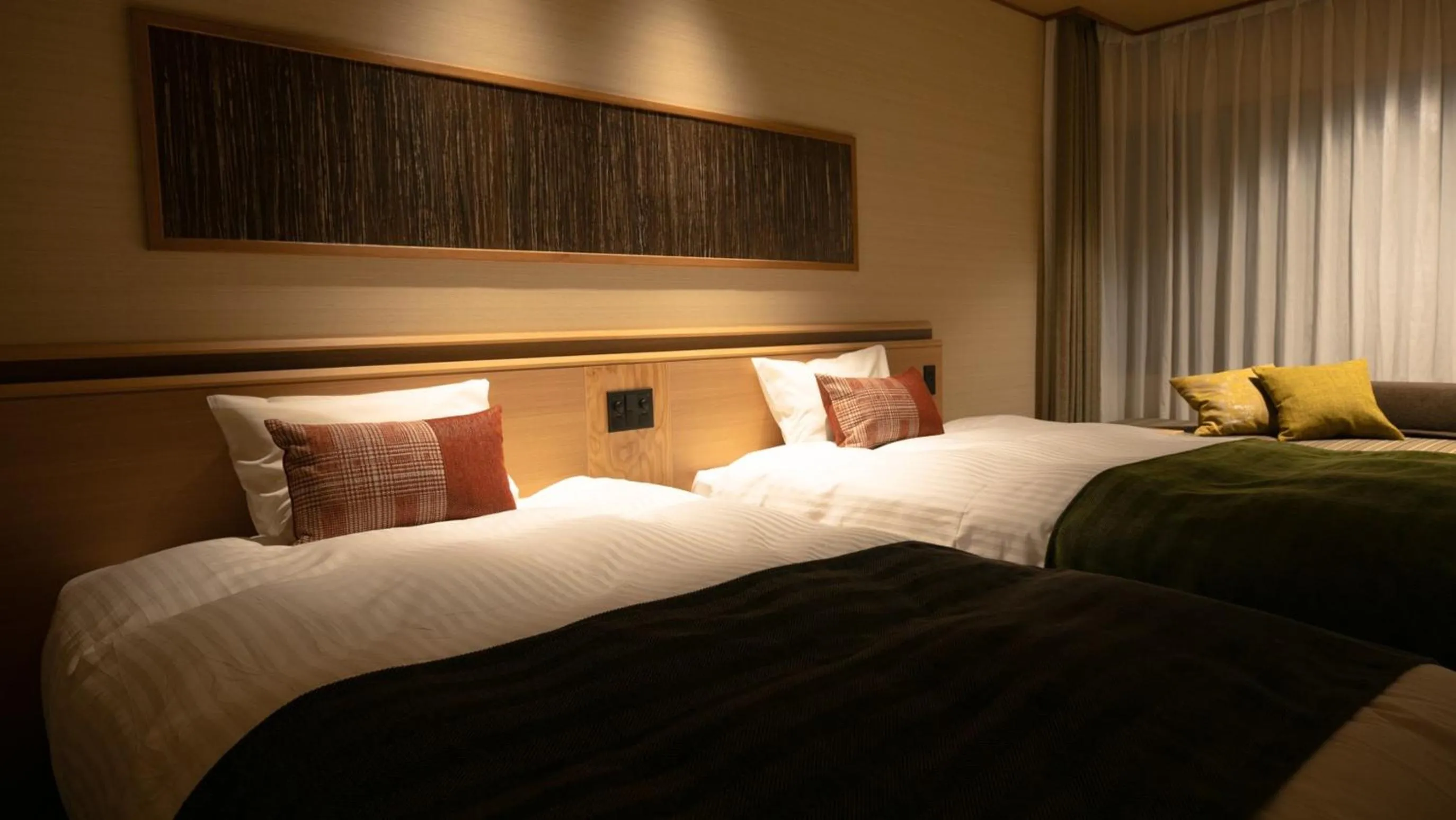 Bed in Kyukamura Retreat-Azumino-Hotel