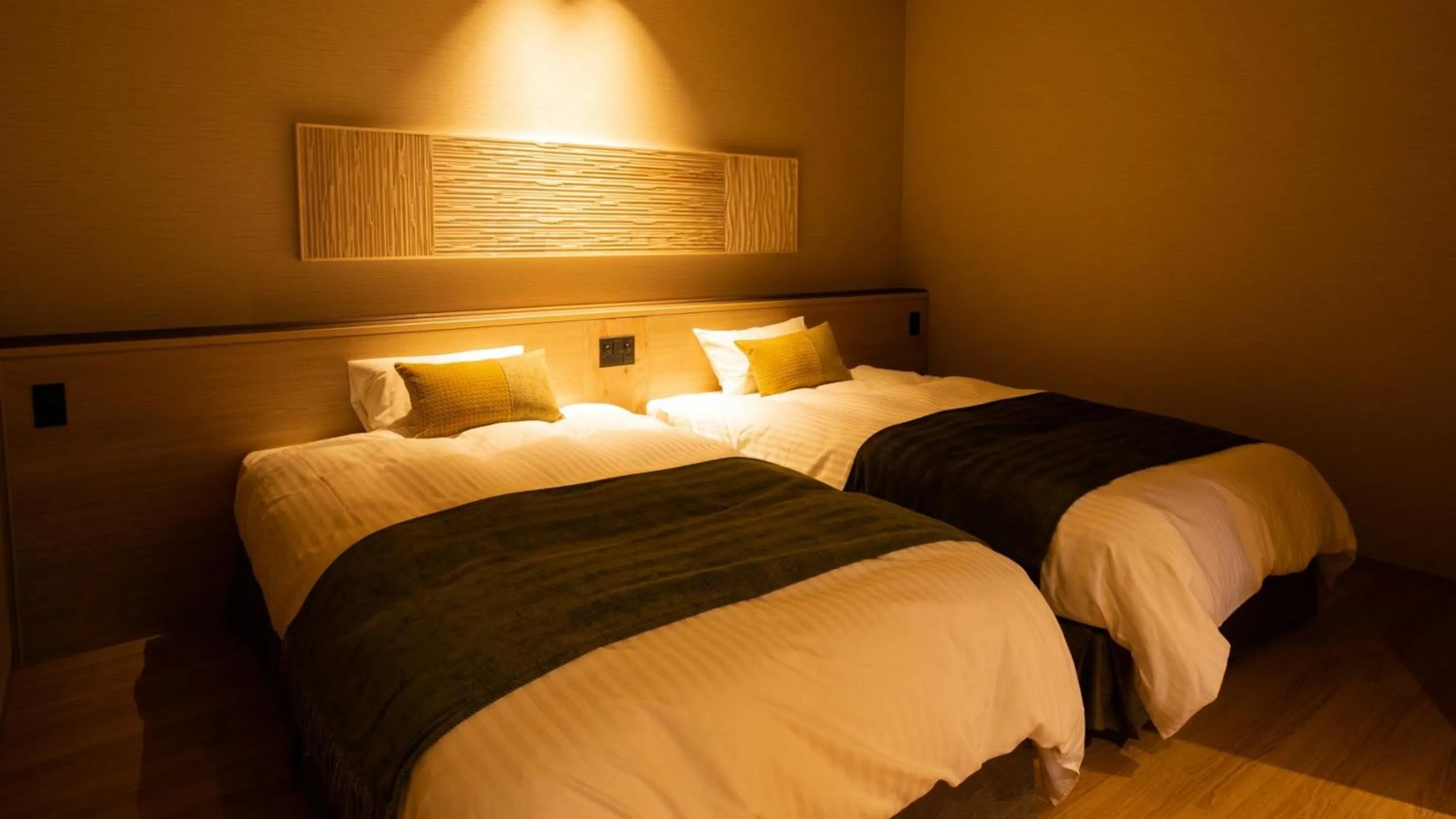 Bed in Kyukamura Retreat-Azumino-Hotel