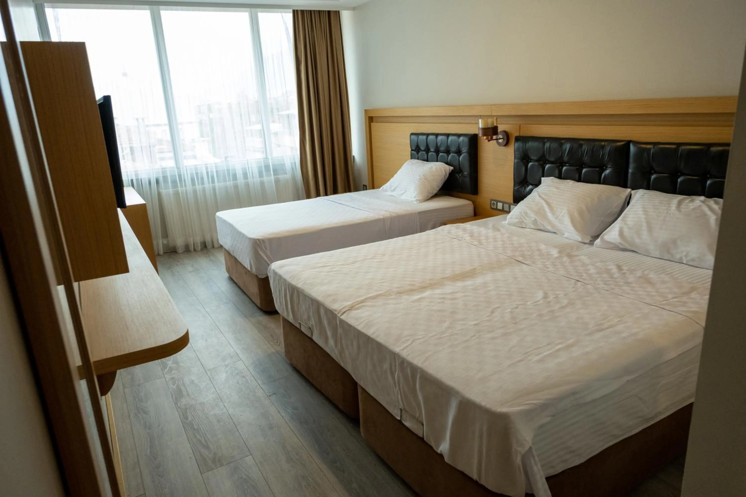 Bed in LOTUSPARK HOTEL