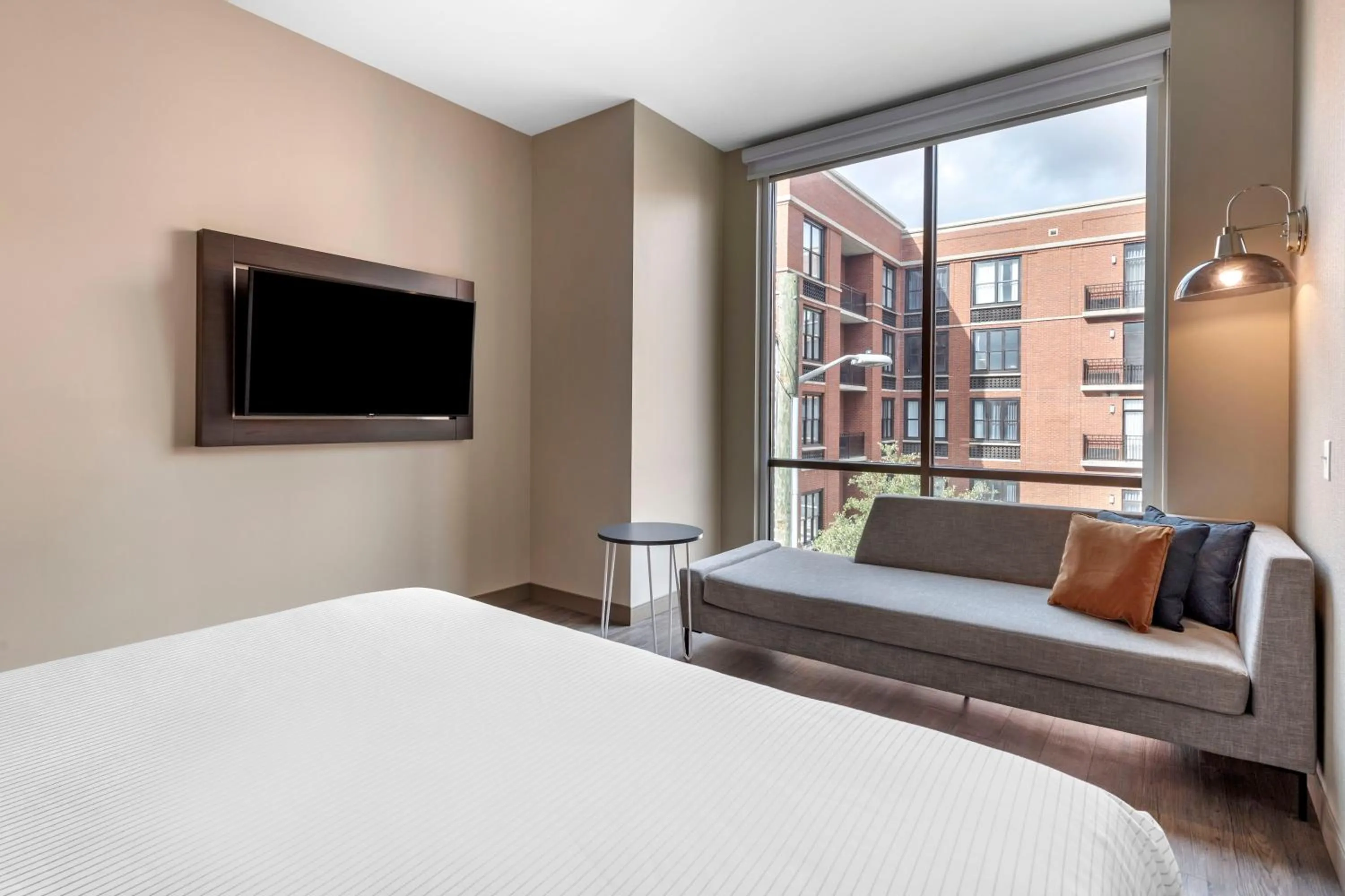 Bed in Cambria Hotel Savannah Downtown Historic District