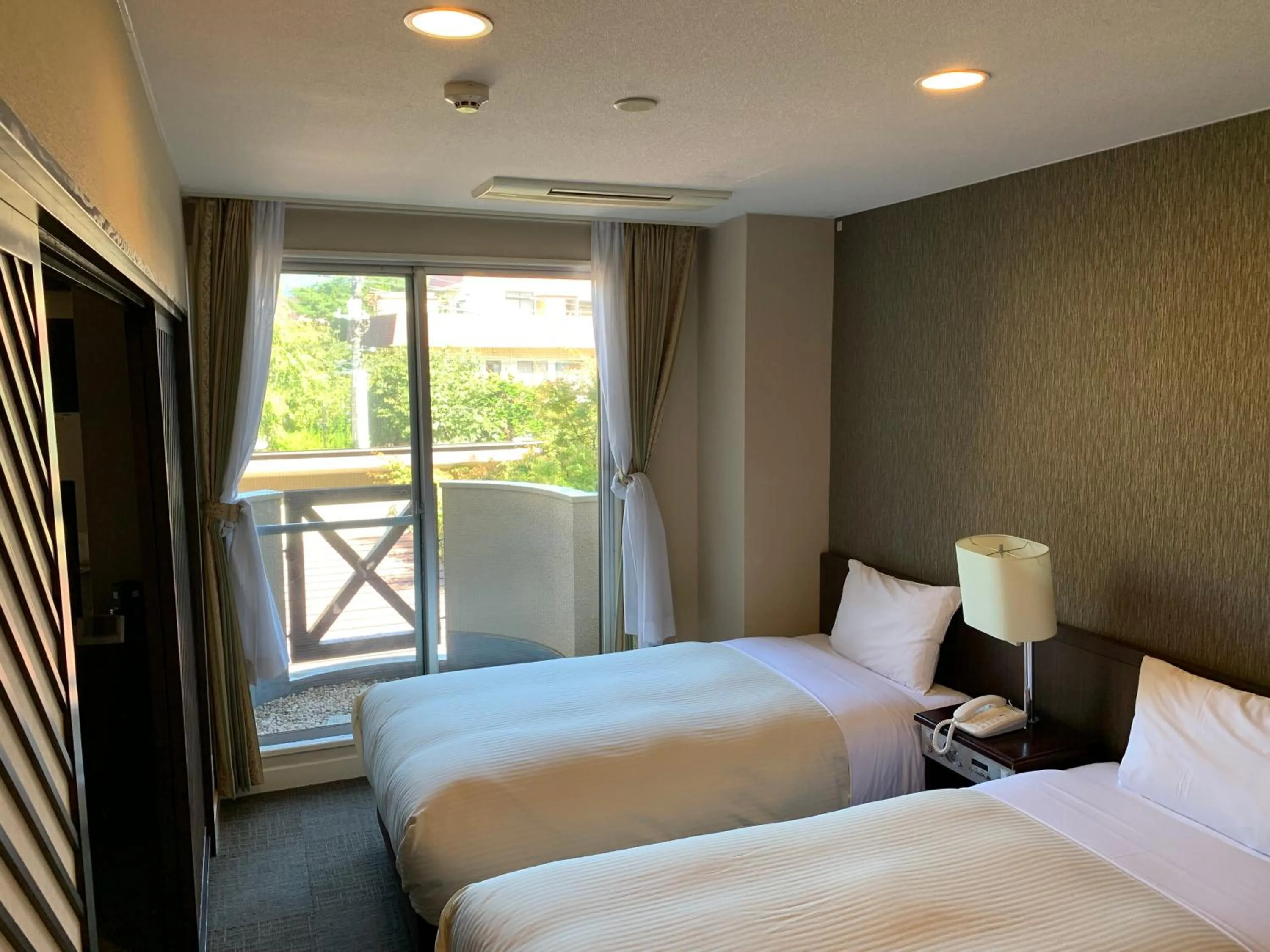 Bed in Kawaguchiko Park Hotel