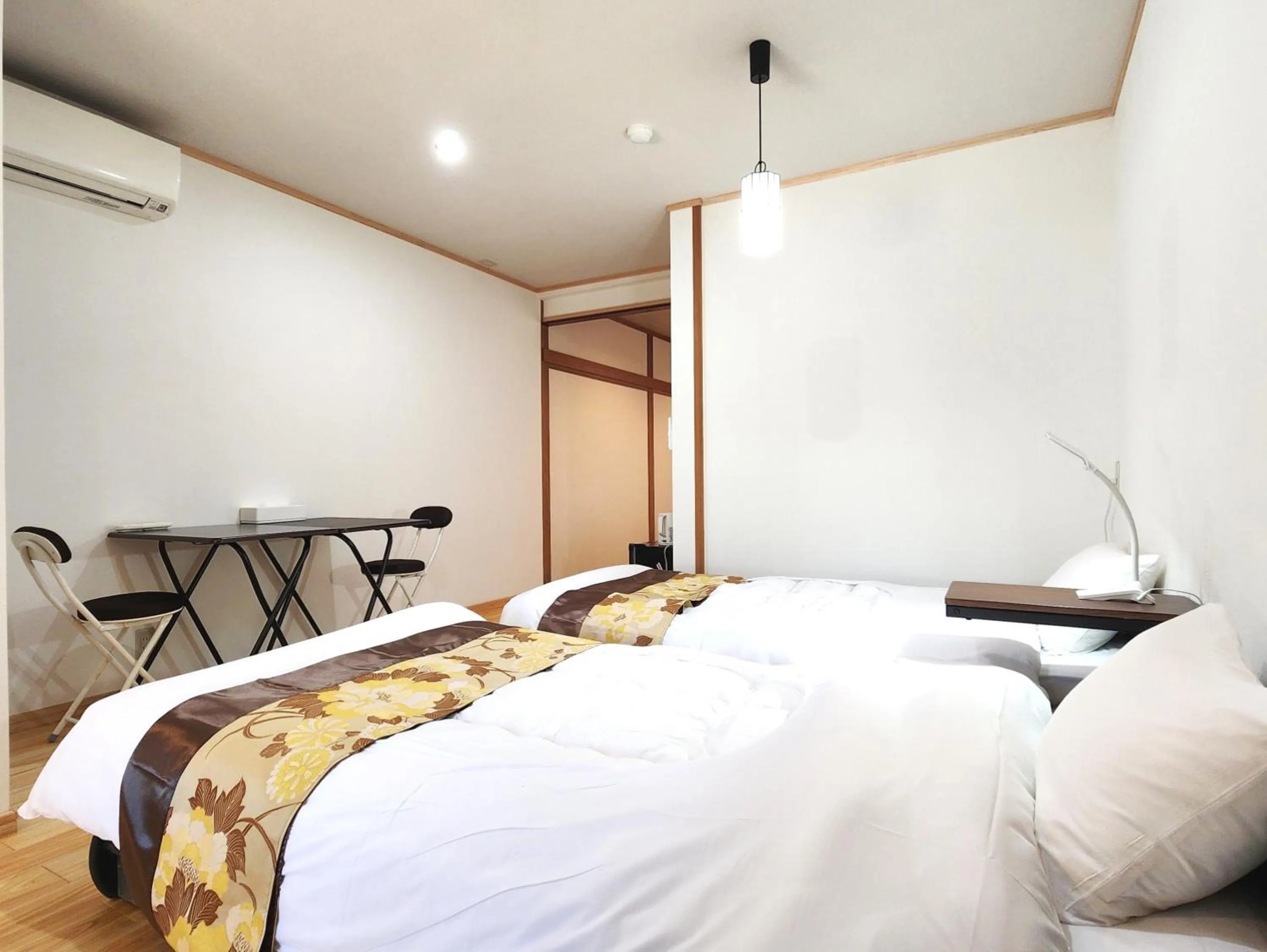 Bed in Guest Room Furusatomura Kogeikan