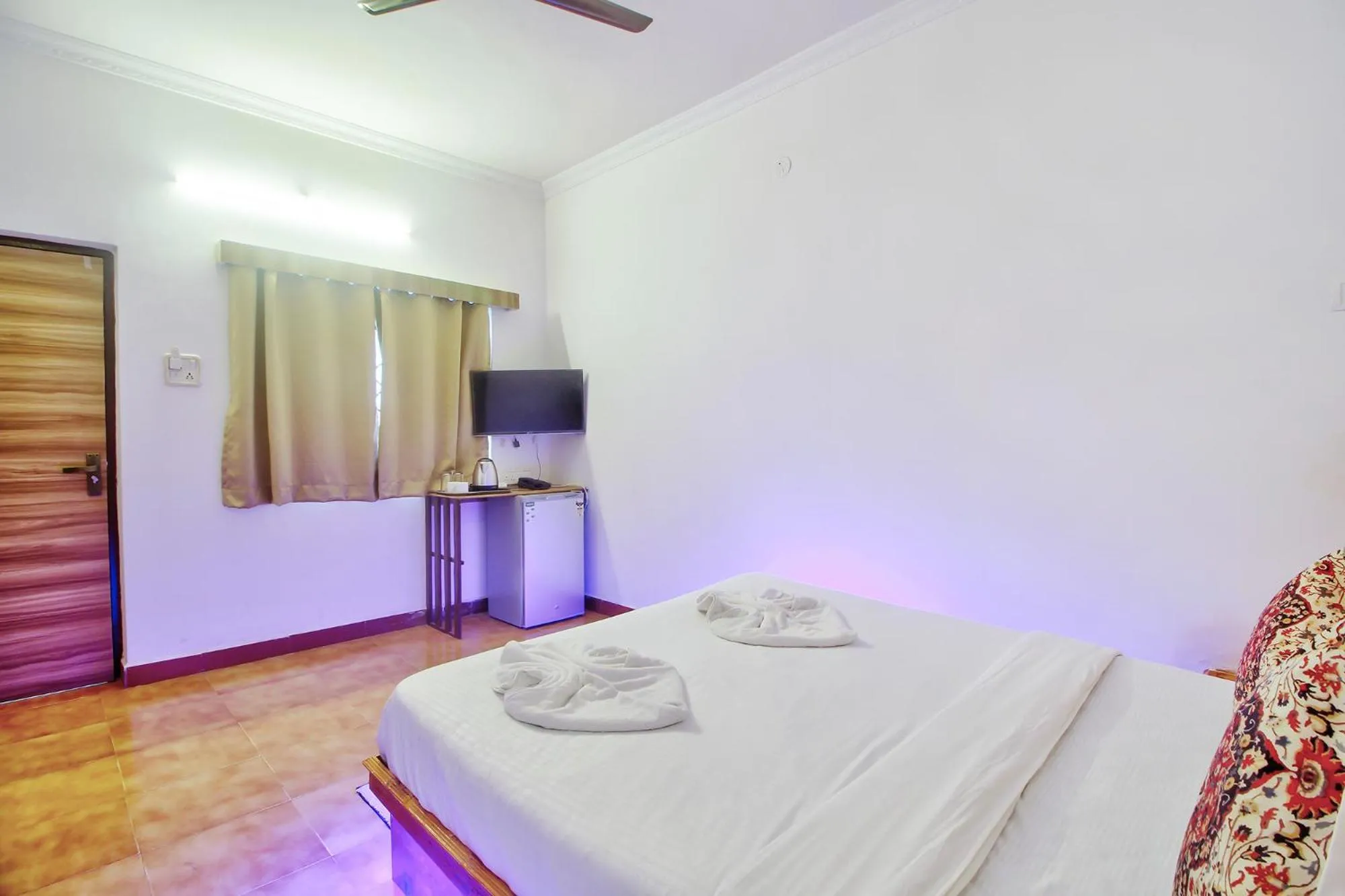 Bed in FabHotel Pleasure Inn