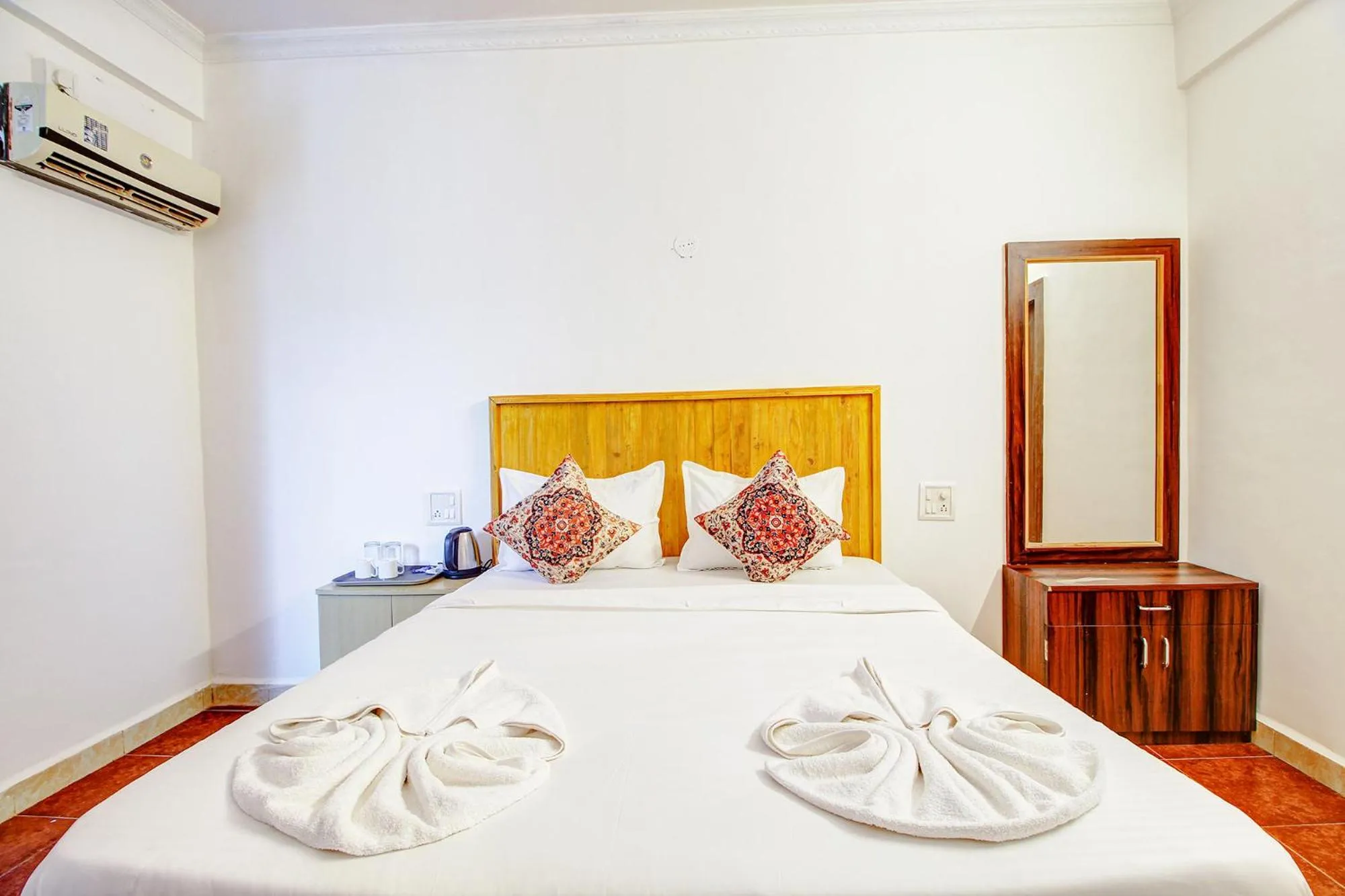 Bed in FabHotel Pleasure Inn