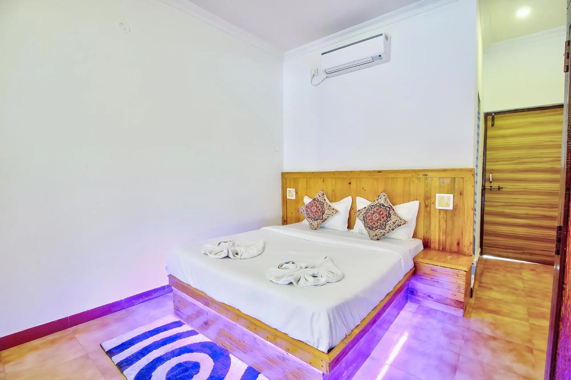 Bed in FabHotel Pleasure Inn