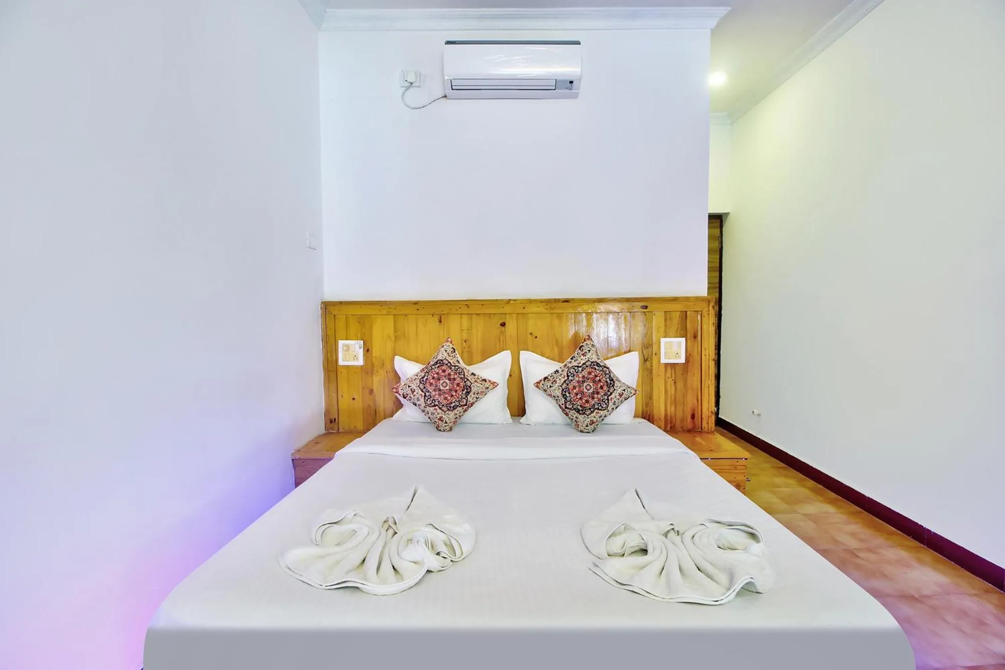 Bed in FabHotel Pleasure Inn