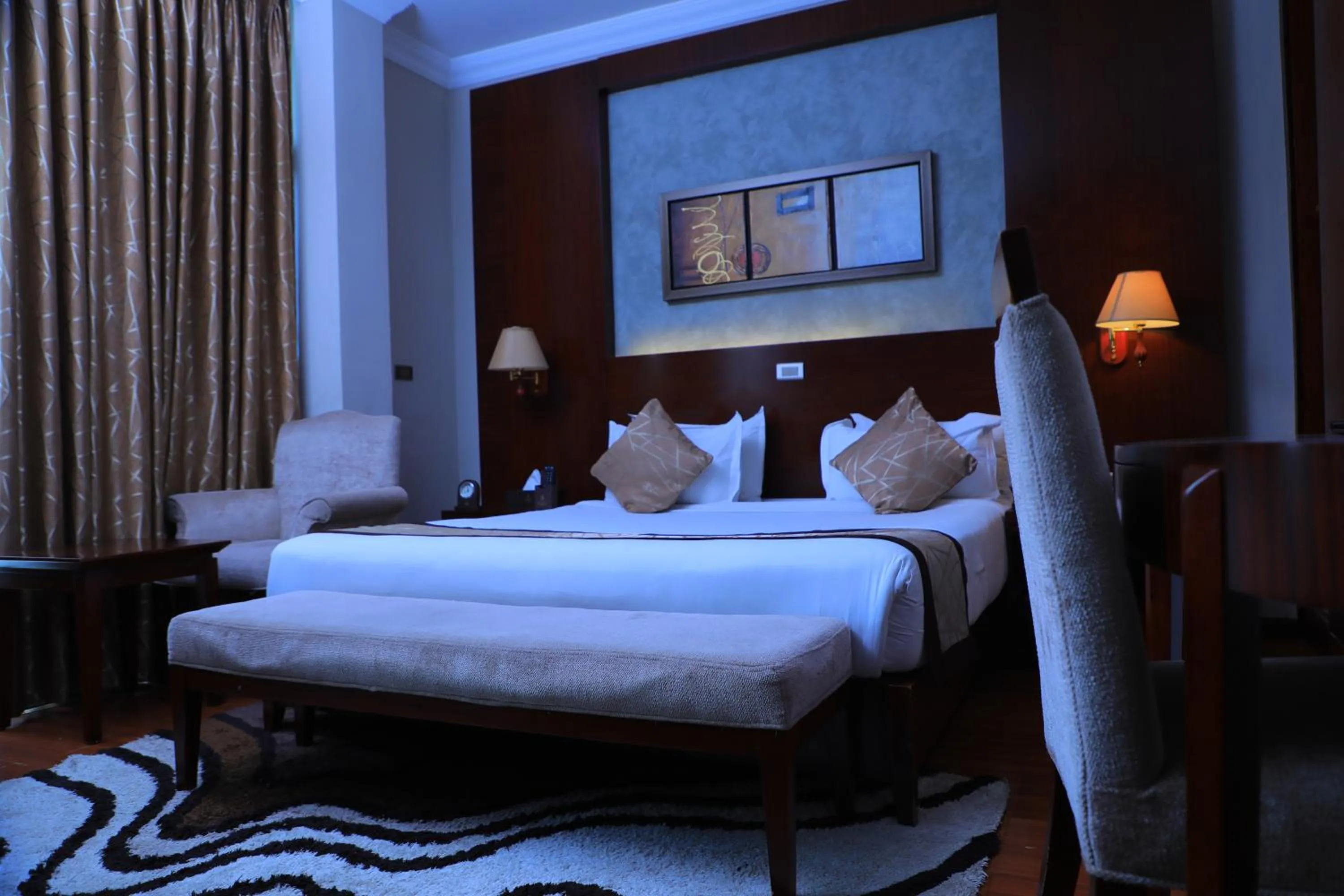 Bed in Sidra International Hotel