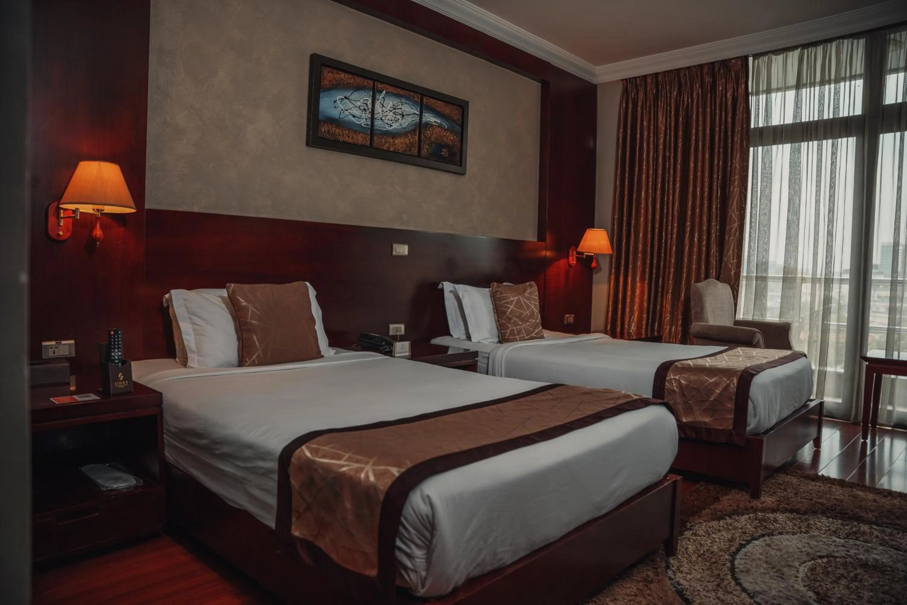 Bed in Sidra International Hotel