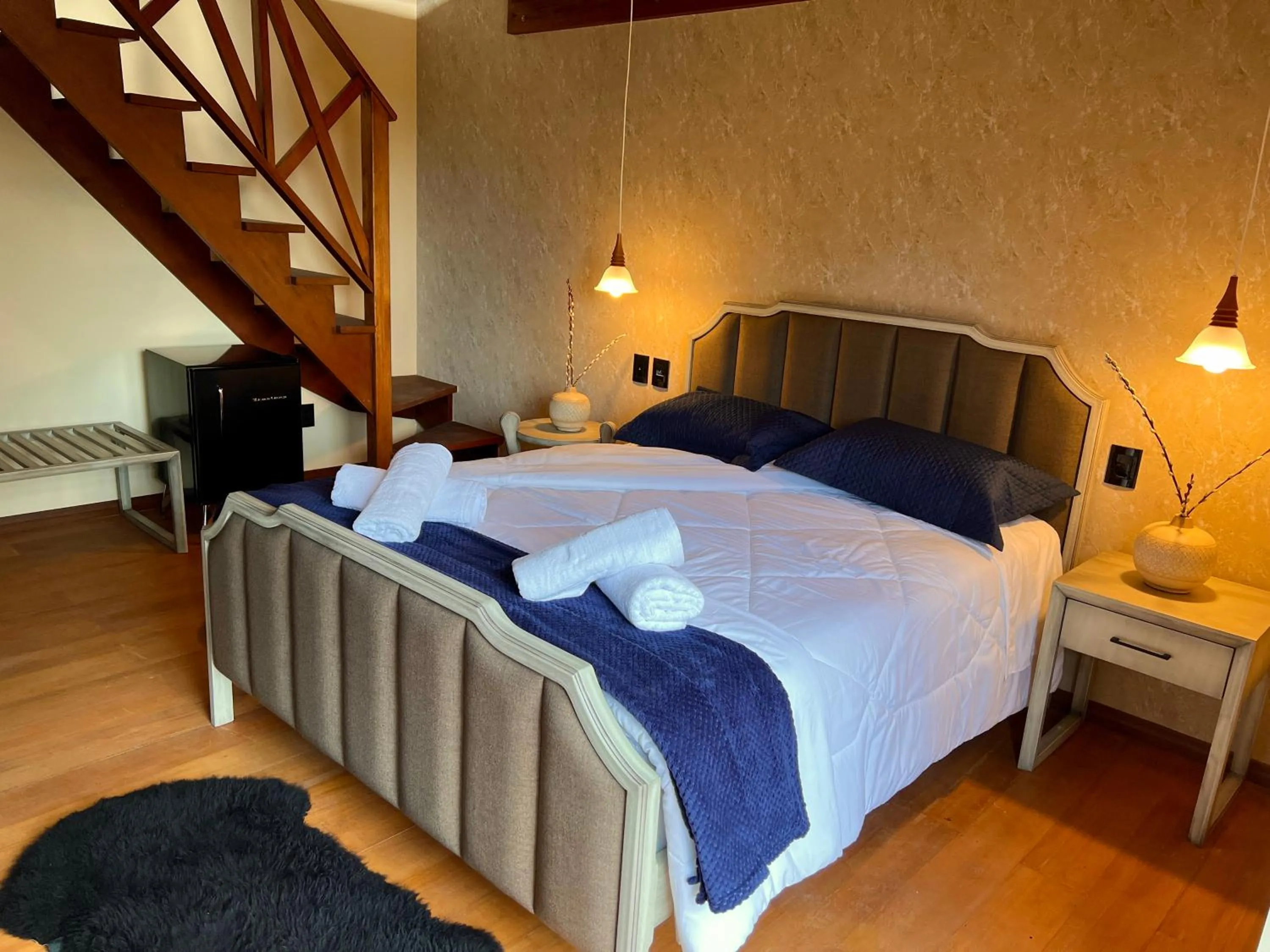 Bed in WoodStone Hotel Fazenda