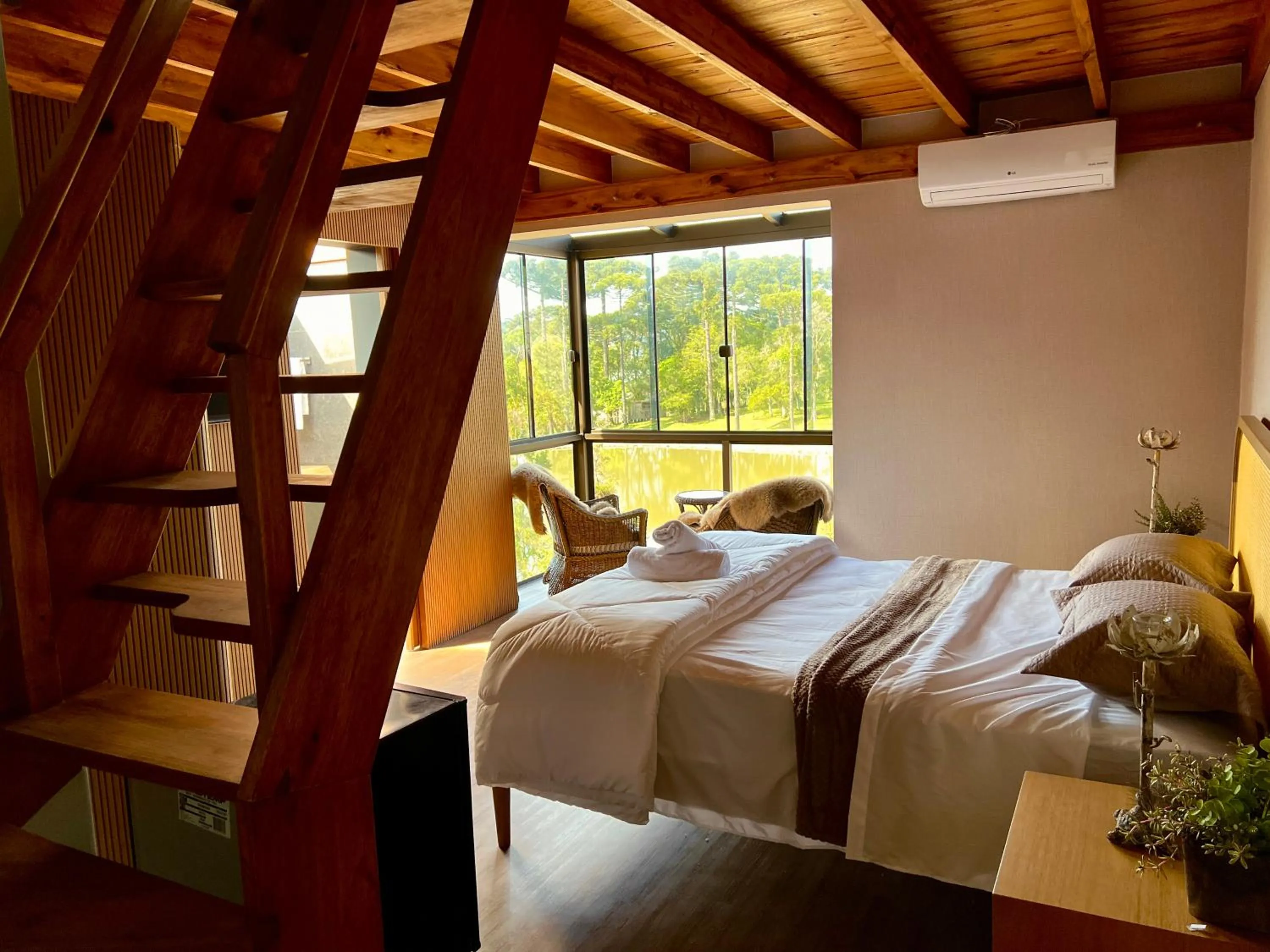 Bed in WoodStone Hotel Fazenda