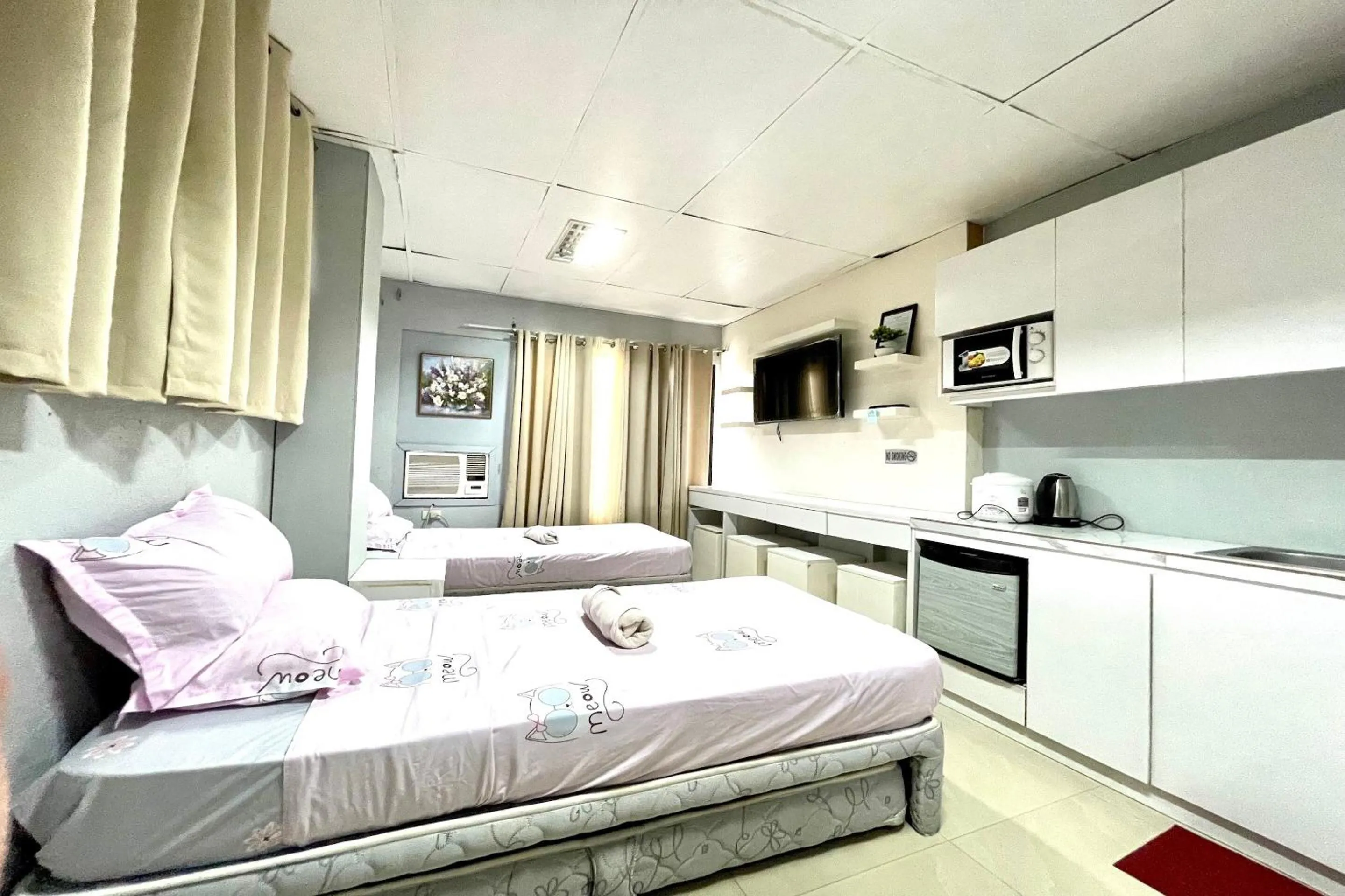 Bedroom in OYO 910 Sabaidee Suites