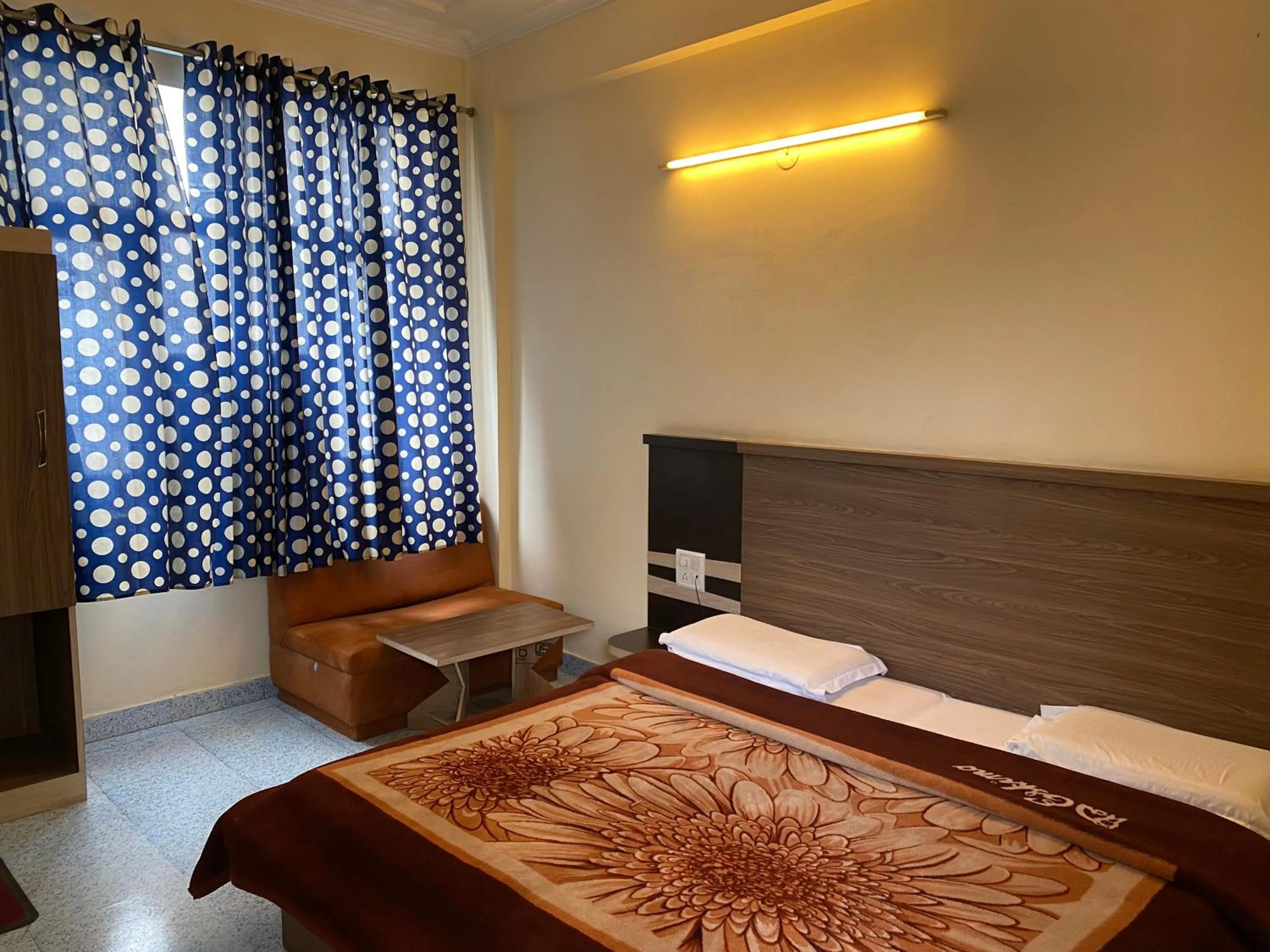 Bed in AASHIRWAD HOTEL