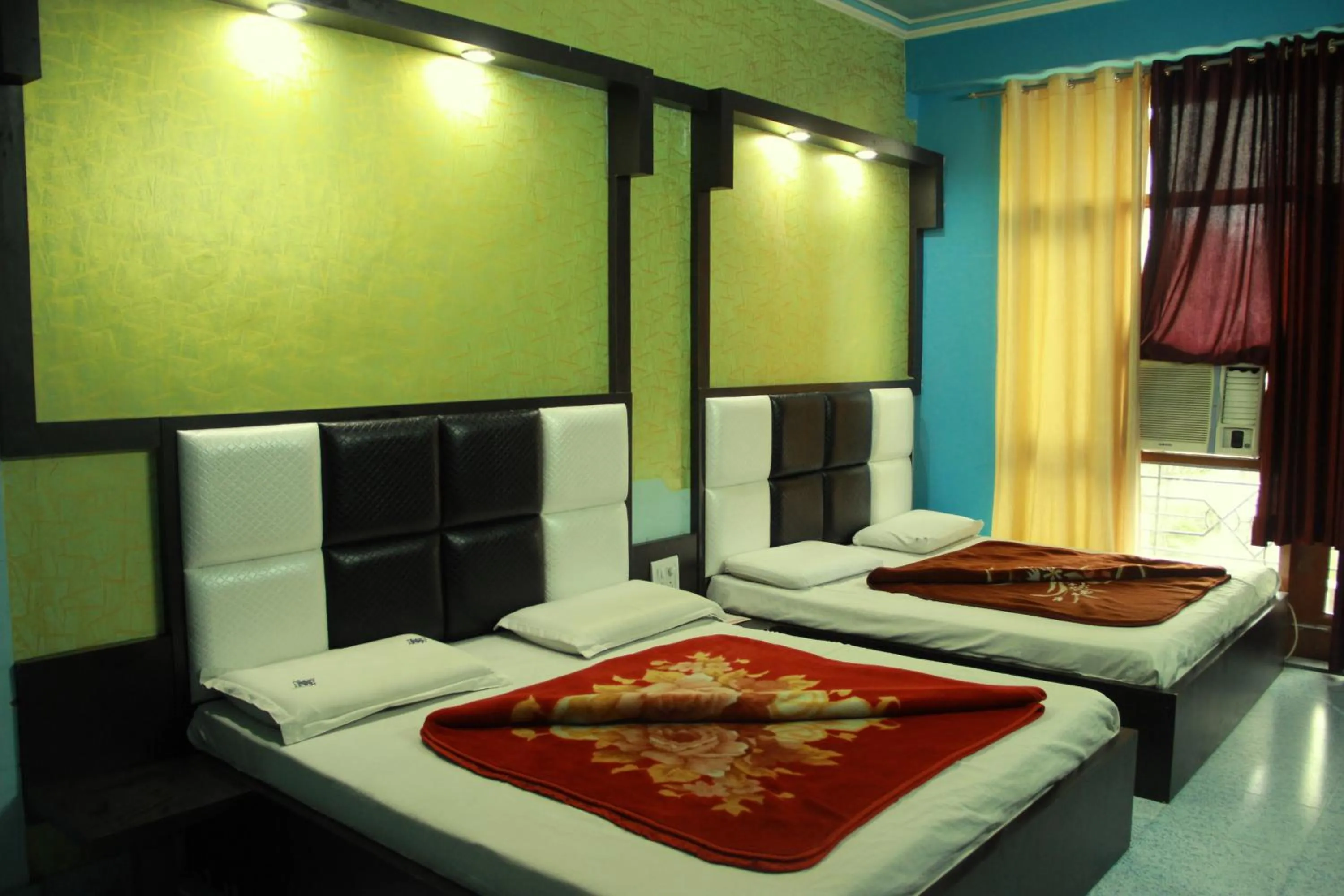 Bed in AASHIRWAD HOTEL