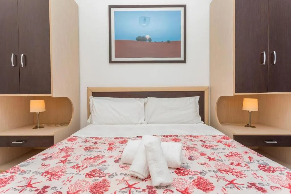 Bed in Sirina House Taormina