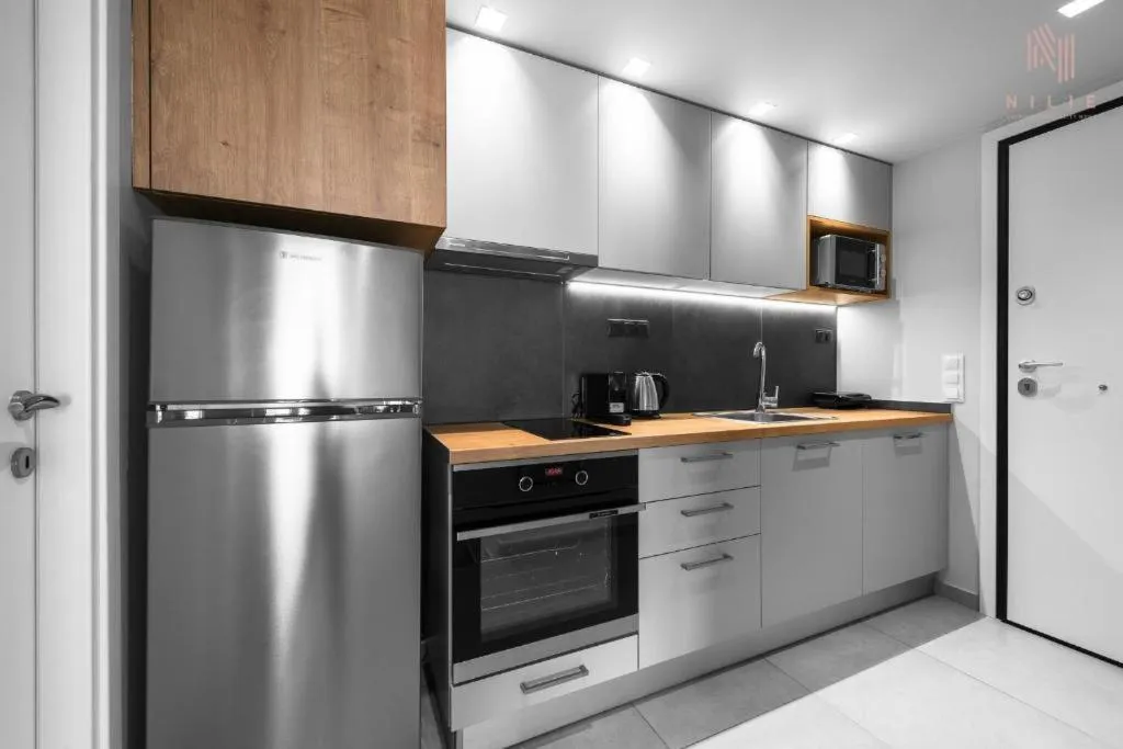 Kitchen or kitchenette in Big Apple, Nilie Hospitality MGMT