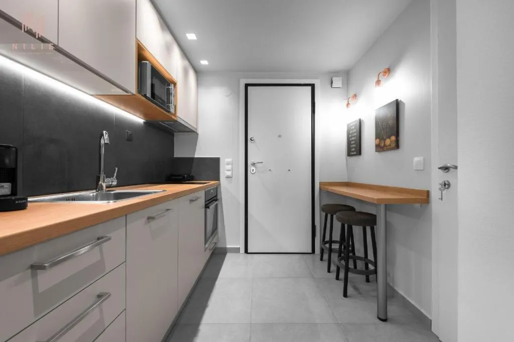 Kitchen or kitchenette in Big Apple, Nilie Hospitality MGMT