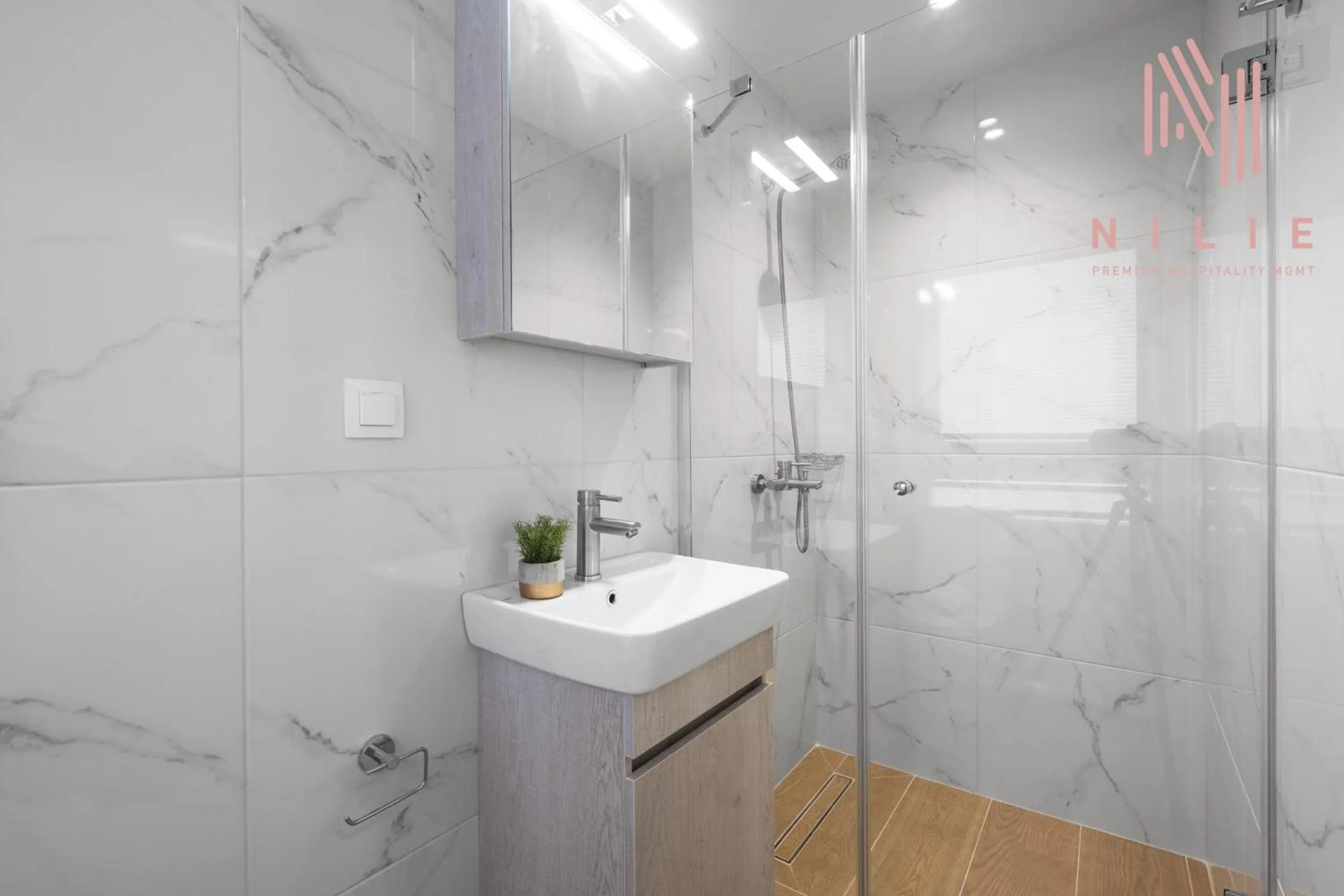 Shower in Big Apple, Nilie Hospitality MGMT