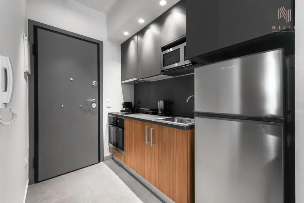 Kitchen or kitchenette in Big Apple, Nilie Hospitality MGMT