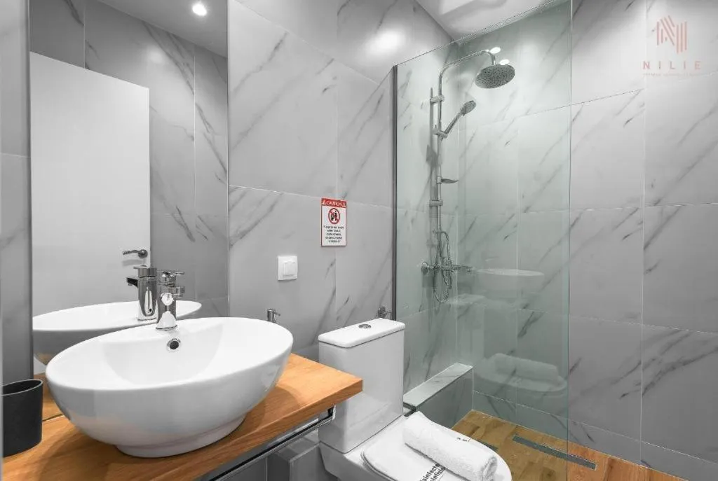 Shower in Big Apple, Nilie Hospitality MGMT