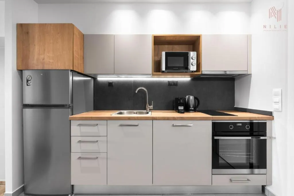 Kitchen or kitchenette in Big Apple, Nilie Hospitality MGMT