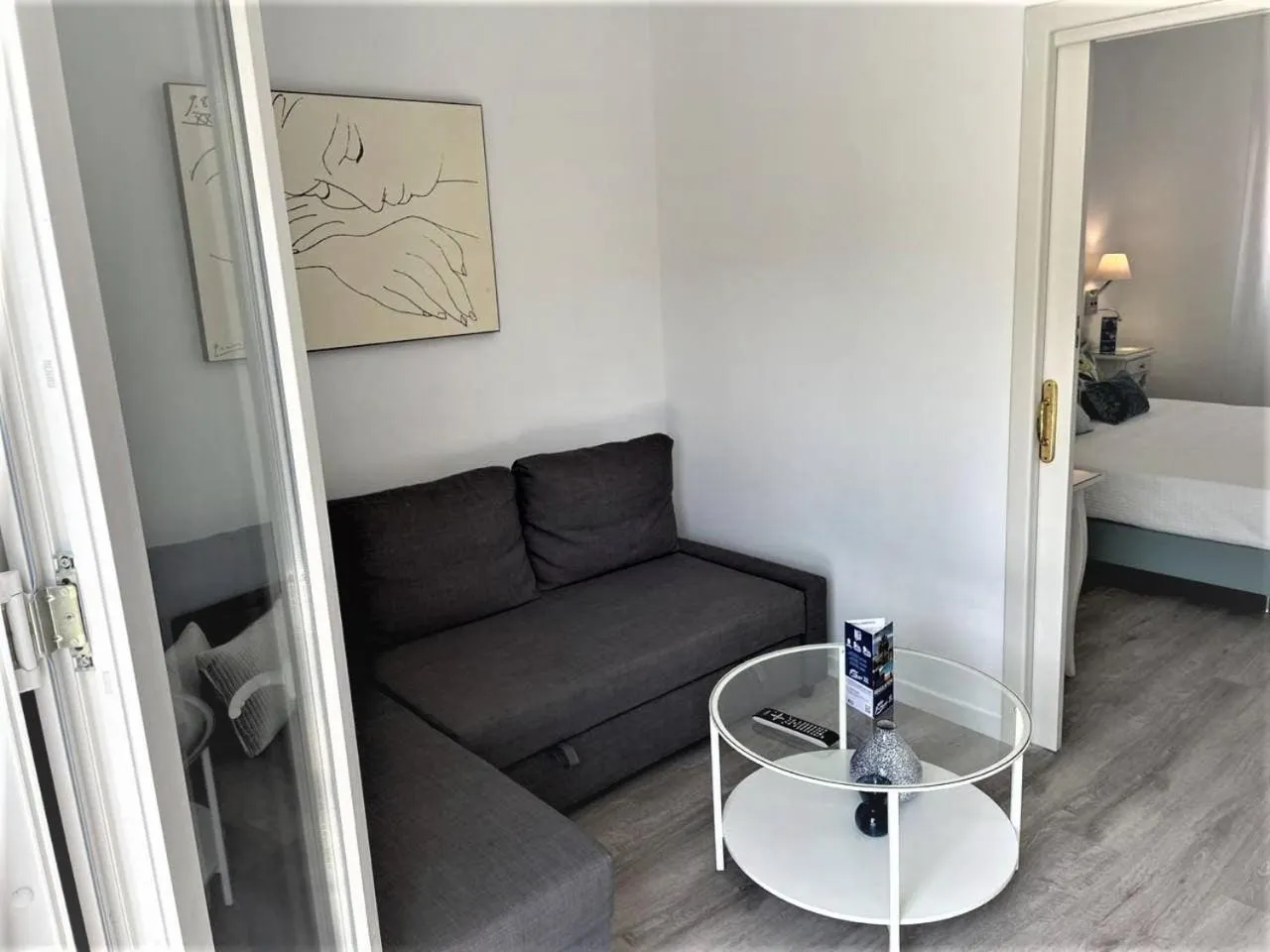 Living room, Bed in Hotel Malaga Picasso