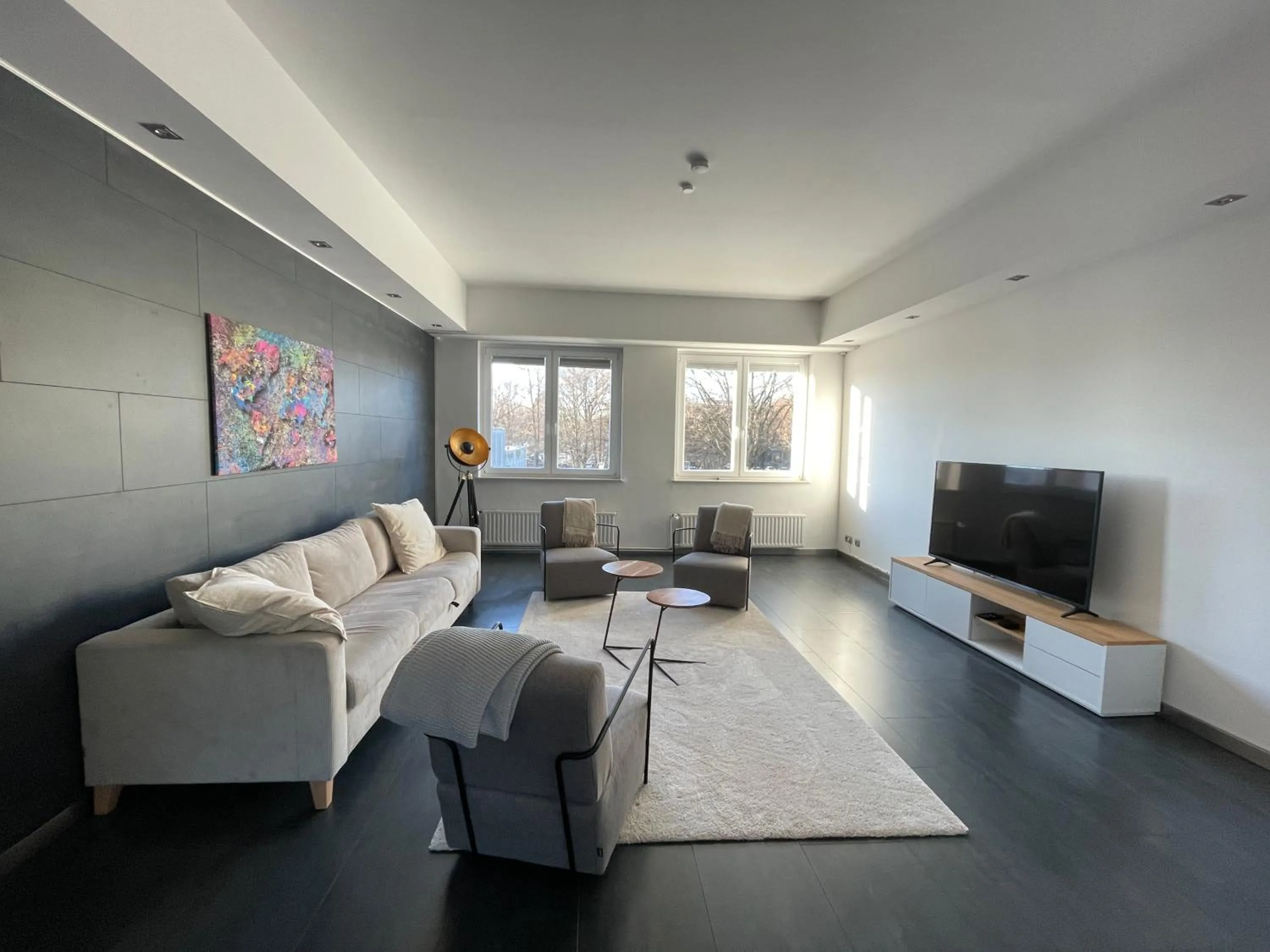 Communal lounge/ TV room in TruRetreats Design Loft für 8 Personen I Riesige Küche I eCharger I 65z SmartTV I 150qm