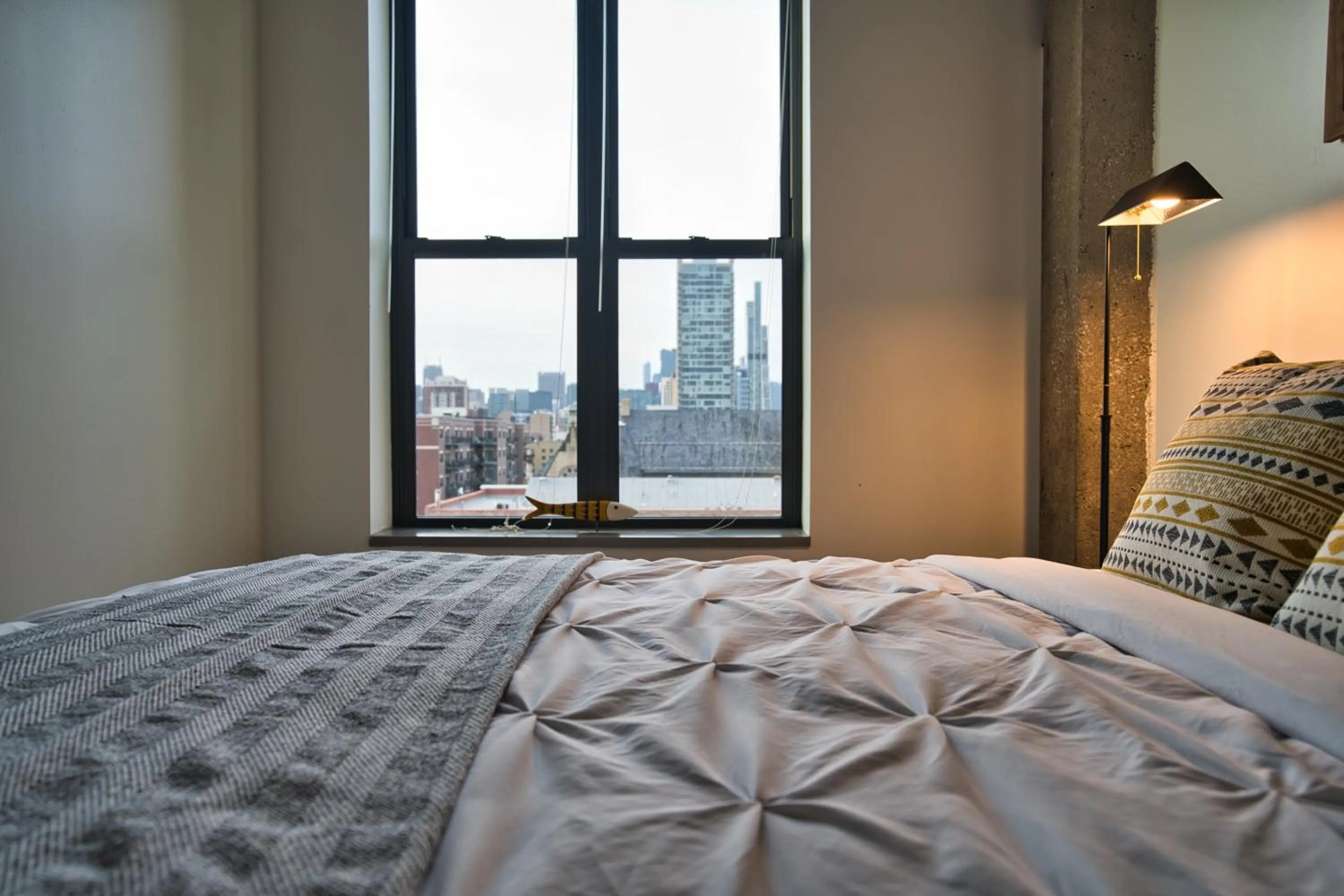 Bed in South Loop 2BR Getaway with Smart TVs & Optional Parking Near McCormick Place, Museum Campus & Downtown