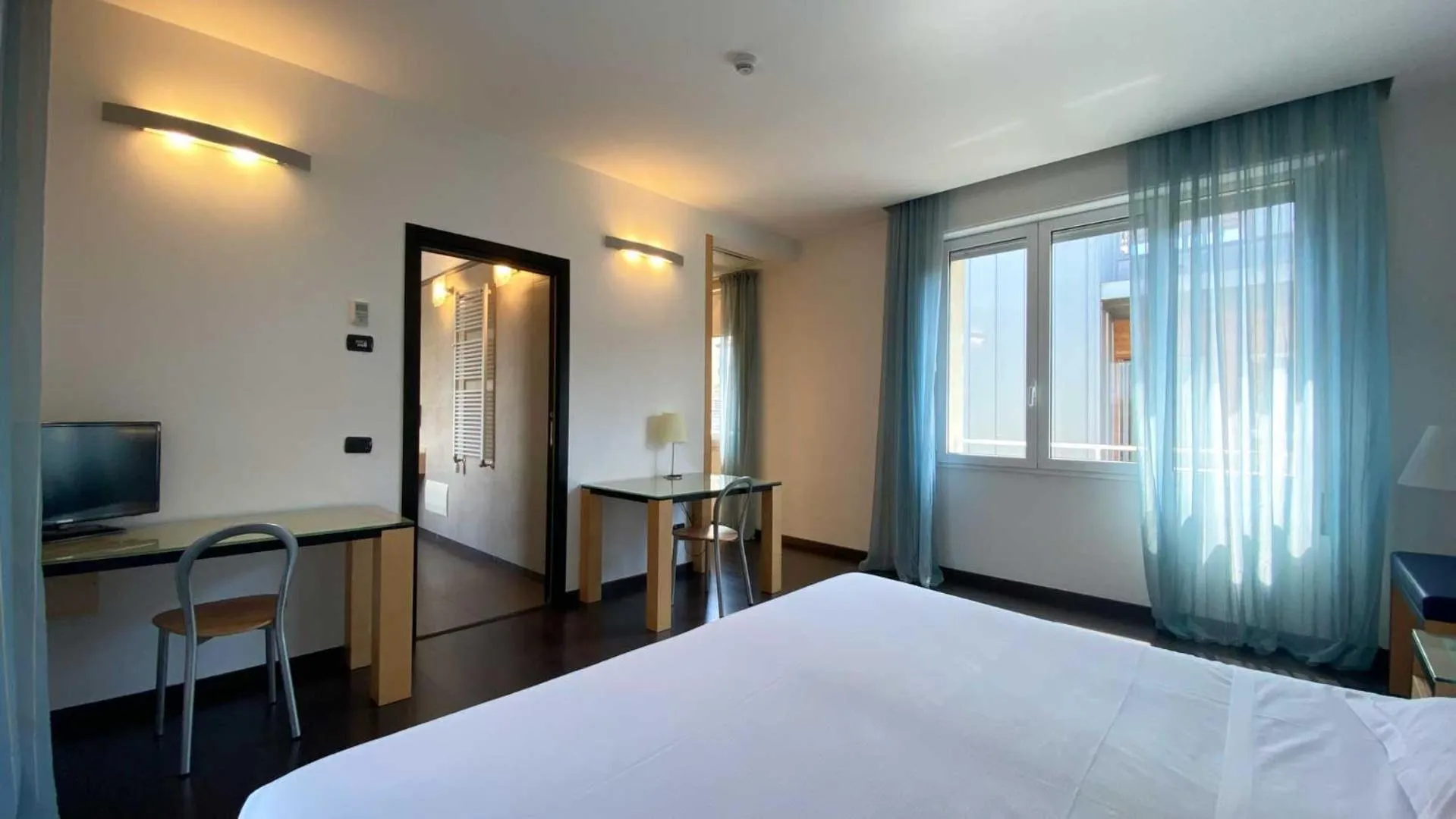 Bed in Luxury Rooms Padova Station