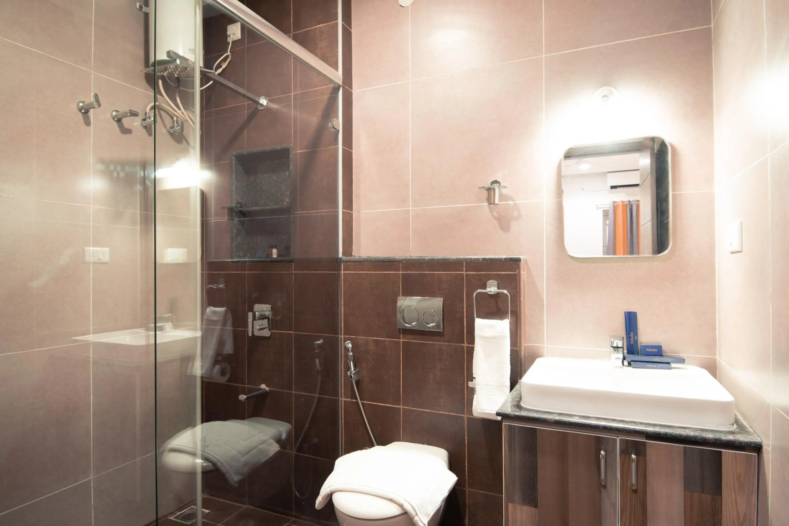 Toilet in Athulya Residence Suite Rooms