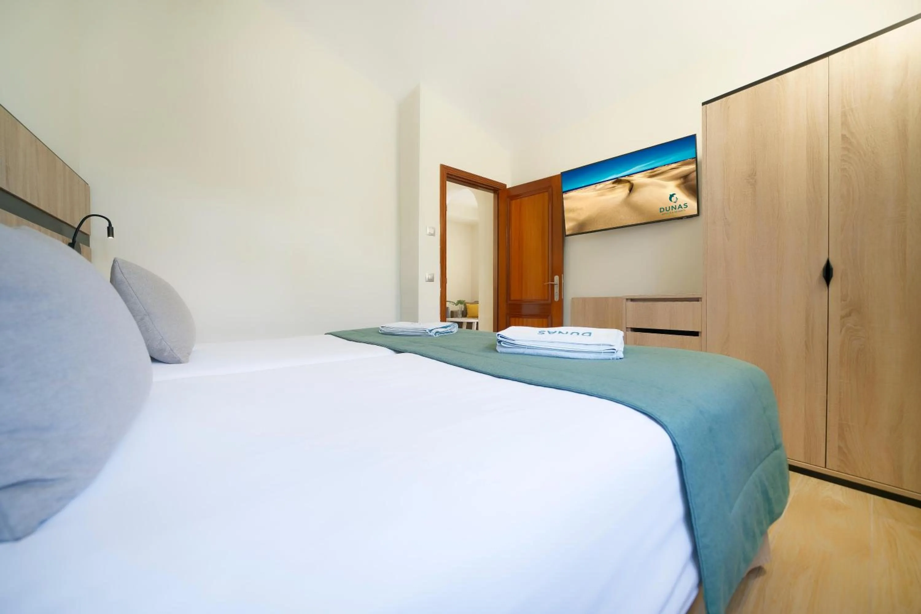 Photo of the whole room, Bed in Suites & Villas by Dunas