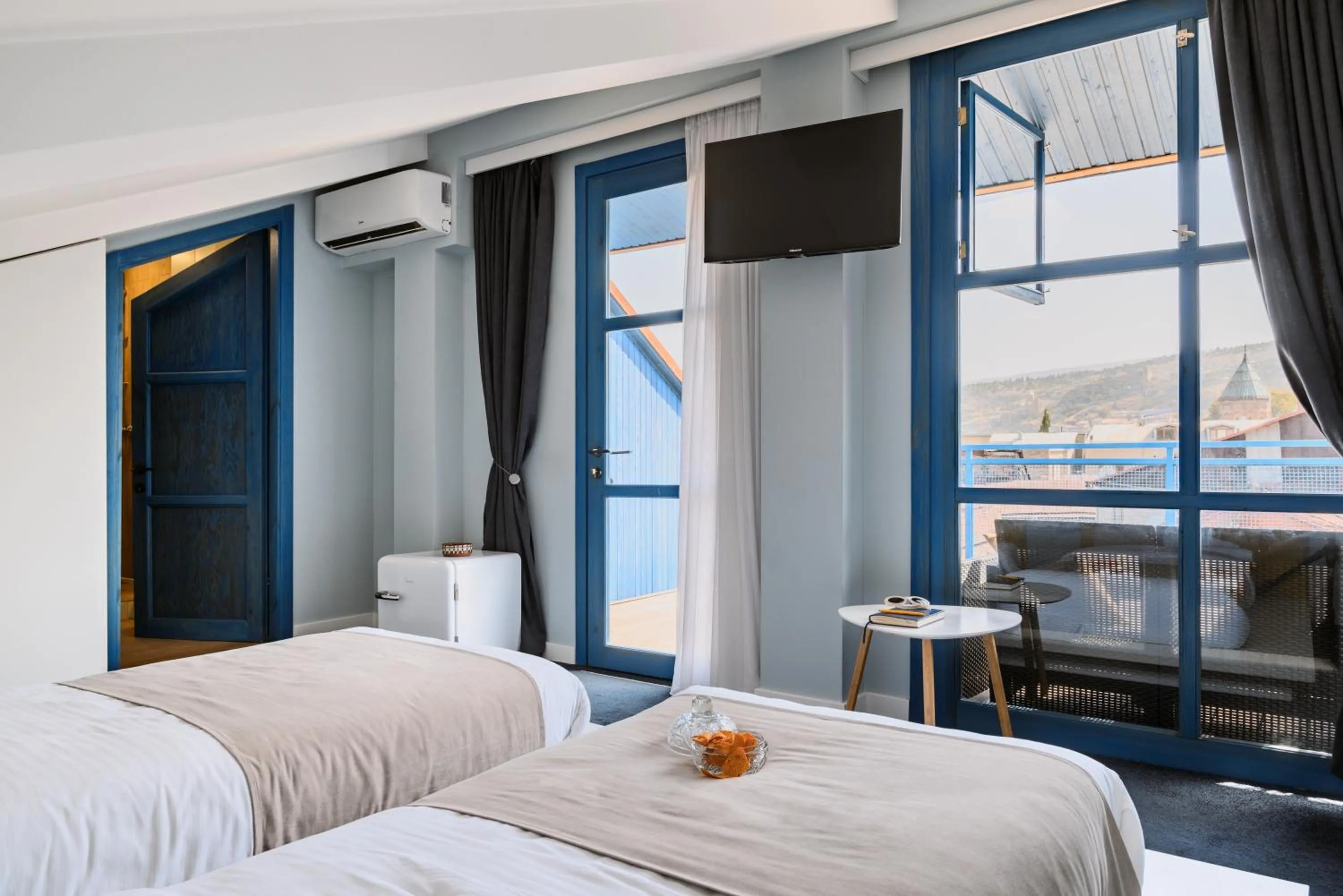 Bed in Blue Balcony Hotel