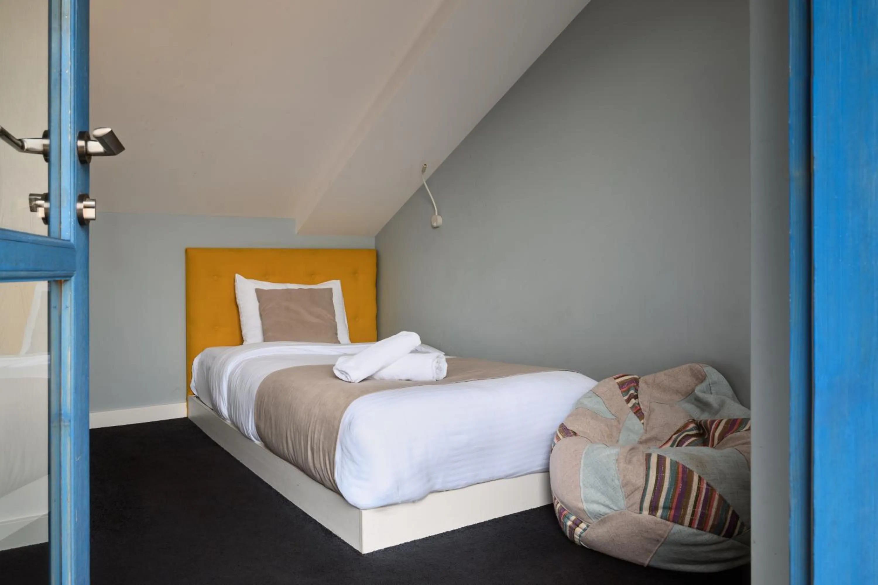 Bed in Blue Balcony Hotel