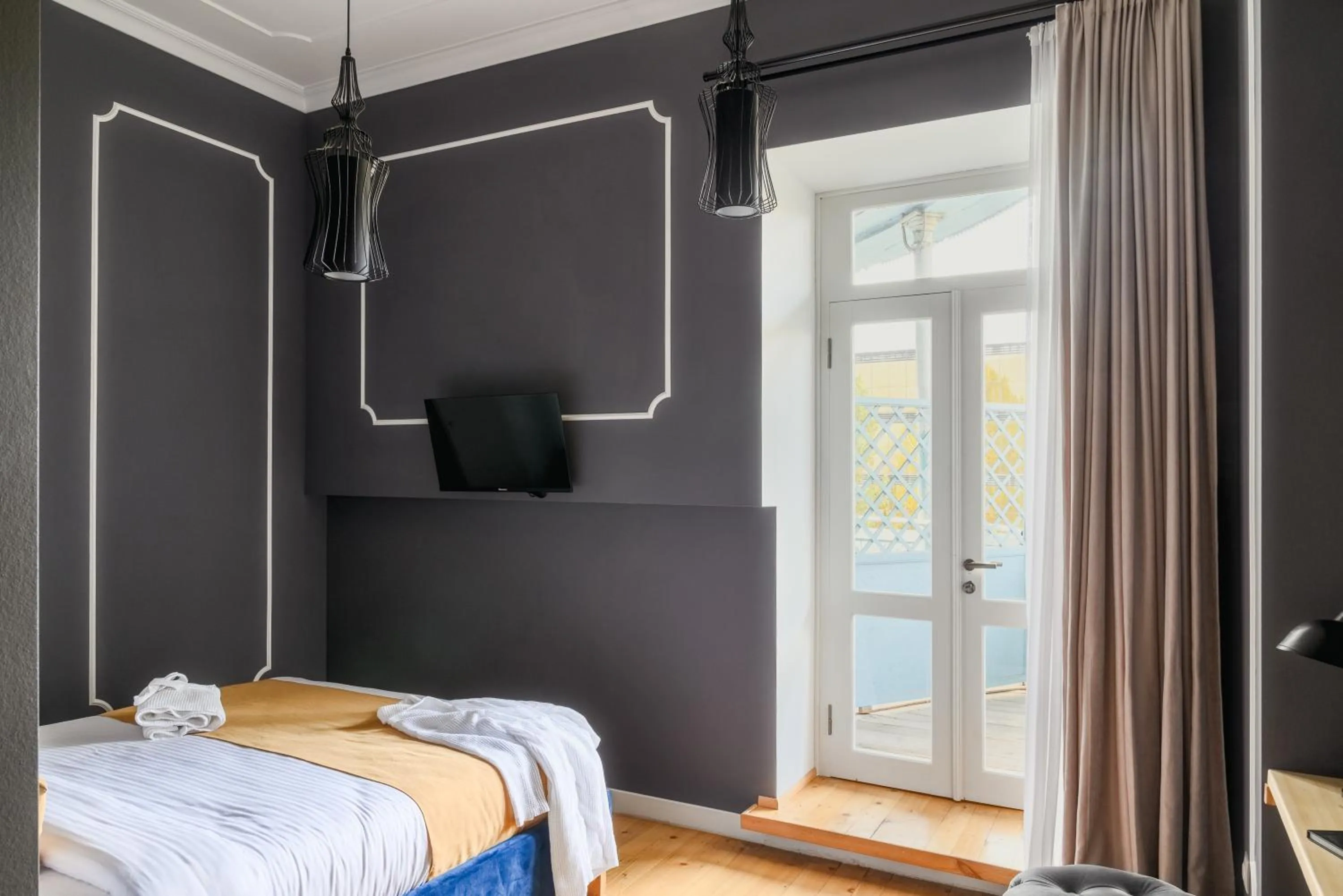 Bed in Blue Balcony Hotel