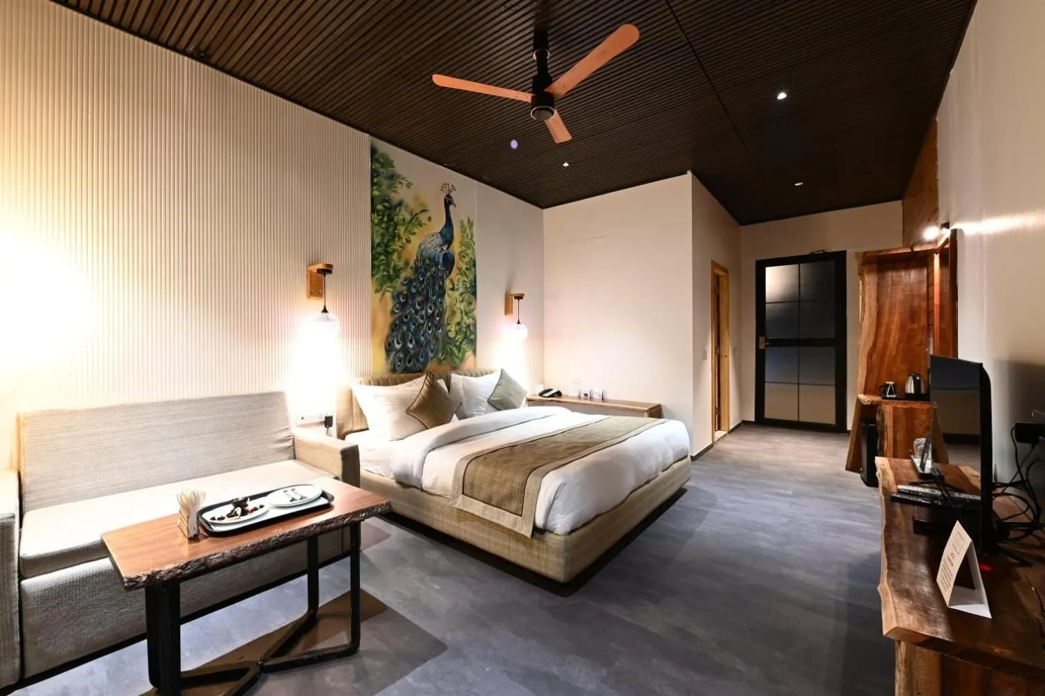 Bed in WelcomHeritage Tarangi Ramganga Resort