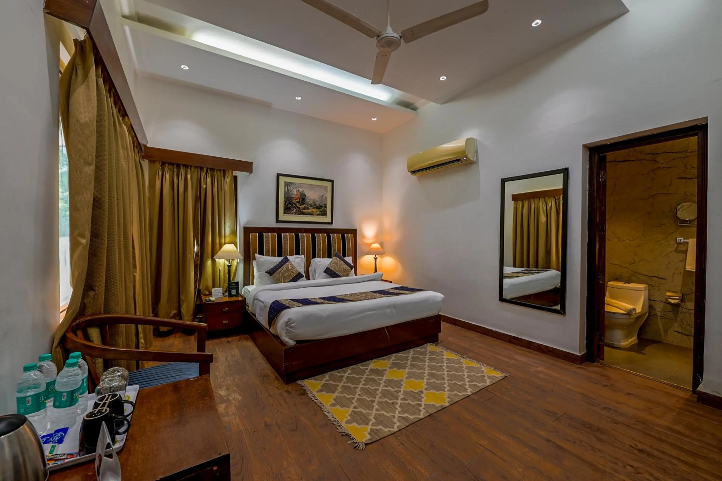 Bed in WelcomHeritage Tarangi Ramganga Resort